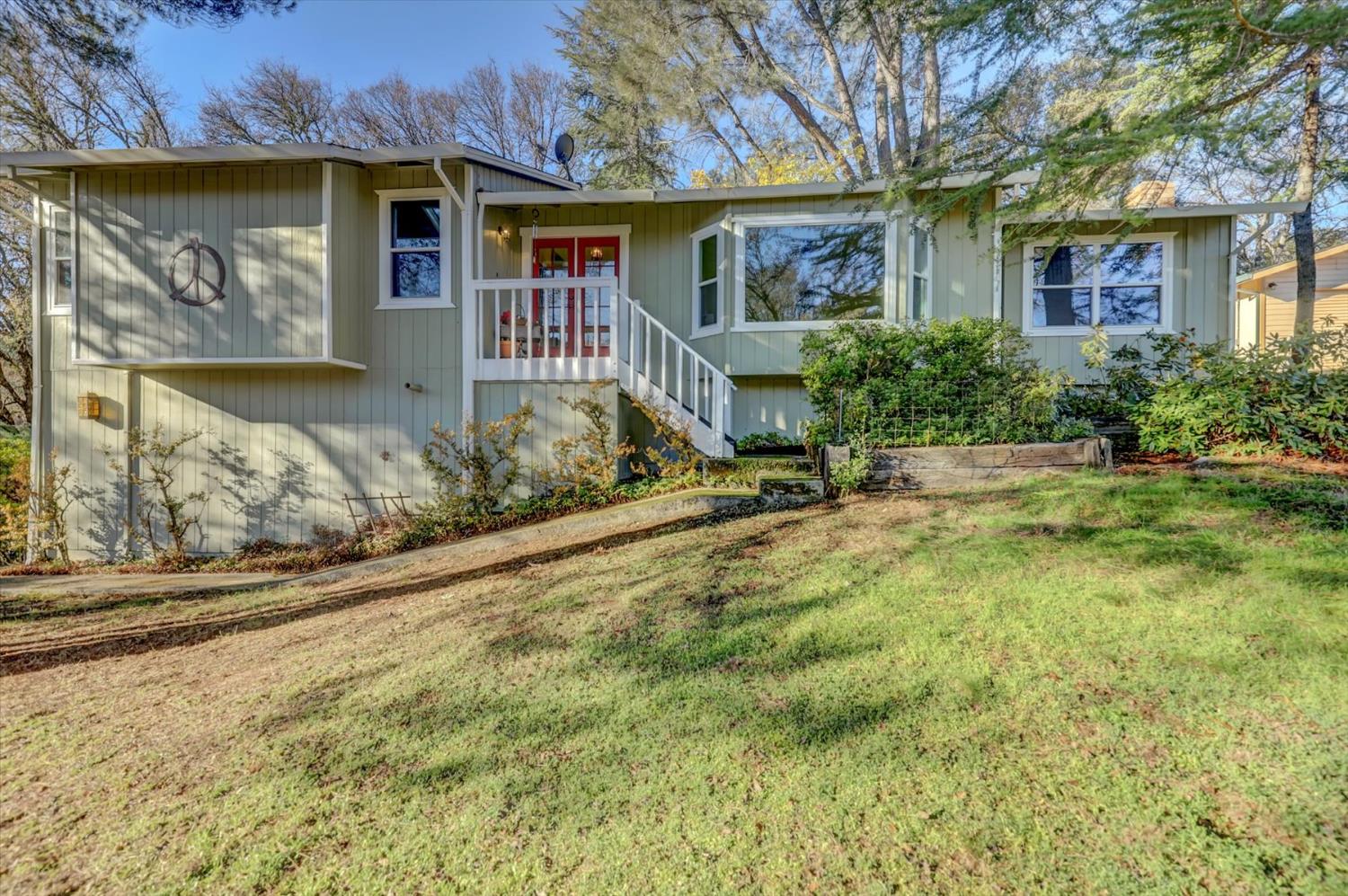 23126 Foothill Road Auburn, CA 95602 - Photo 59 of 63 a view of a house with a yard and large tree
