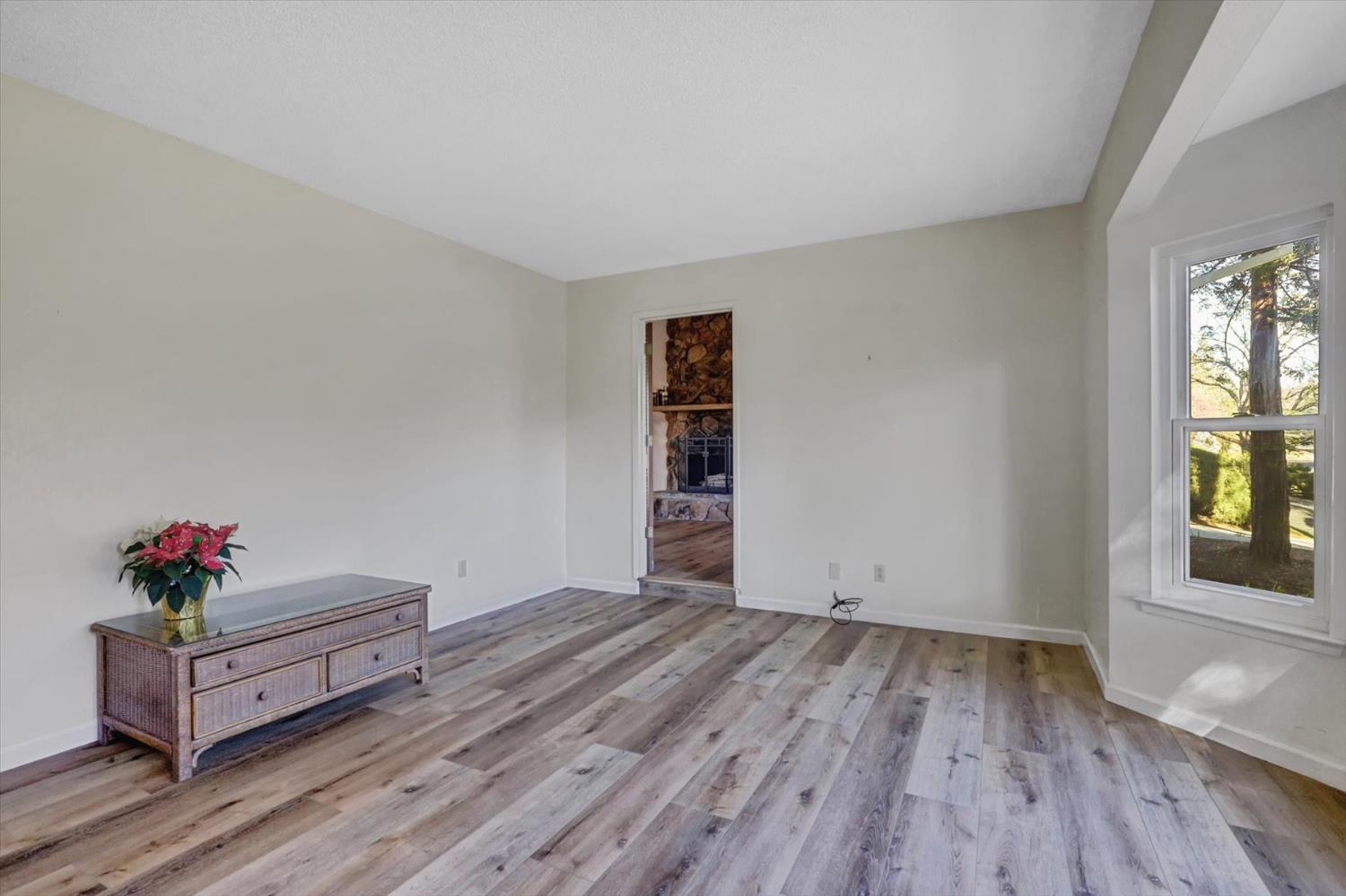 23126 Foothill Road Auburn, CA 95602 - Photo 6 of 63 a view of a room with wooden floor and cabinet