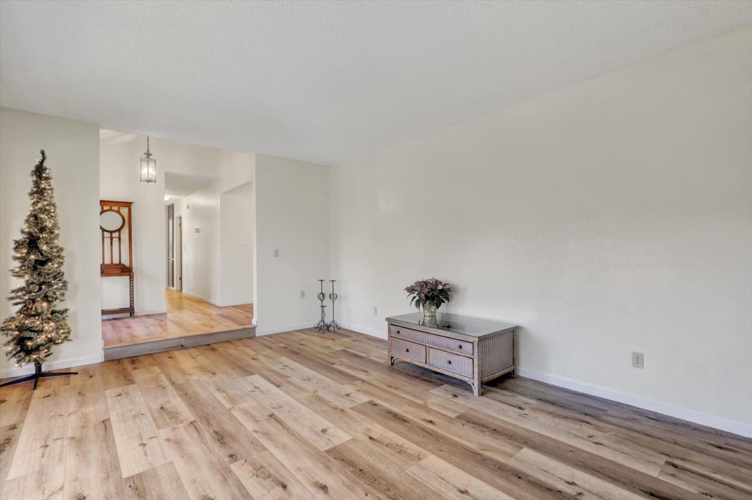 23126 Foothill Road Auburn, CA 95602 - Photo 7 of 63 a view of an empty room and wooden floor