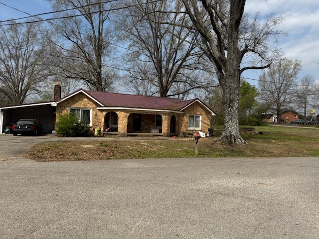 176 Buckner Street Parsons, TN 38363 - Photo 4 of 9 a front view of house with yard and green space