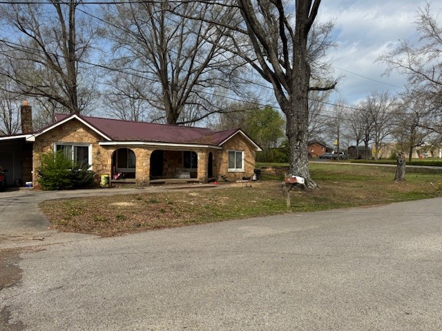 176 Buckner Street Parsons, TN 38363 - Photo 5 of 9 a front view of a house with a yard