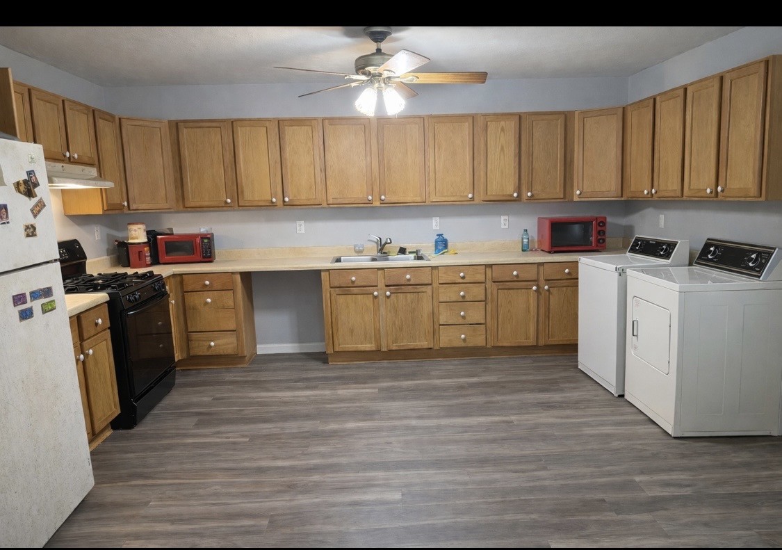 176 Buckner Street Parsons, TN 38363 - Photo 9 of 9 a kitchen with a sink cabinets and window