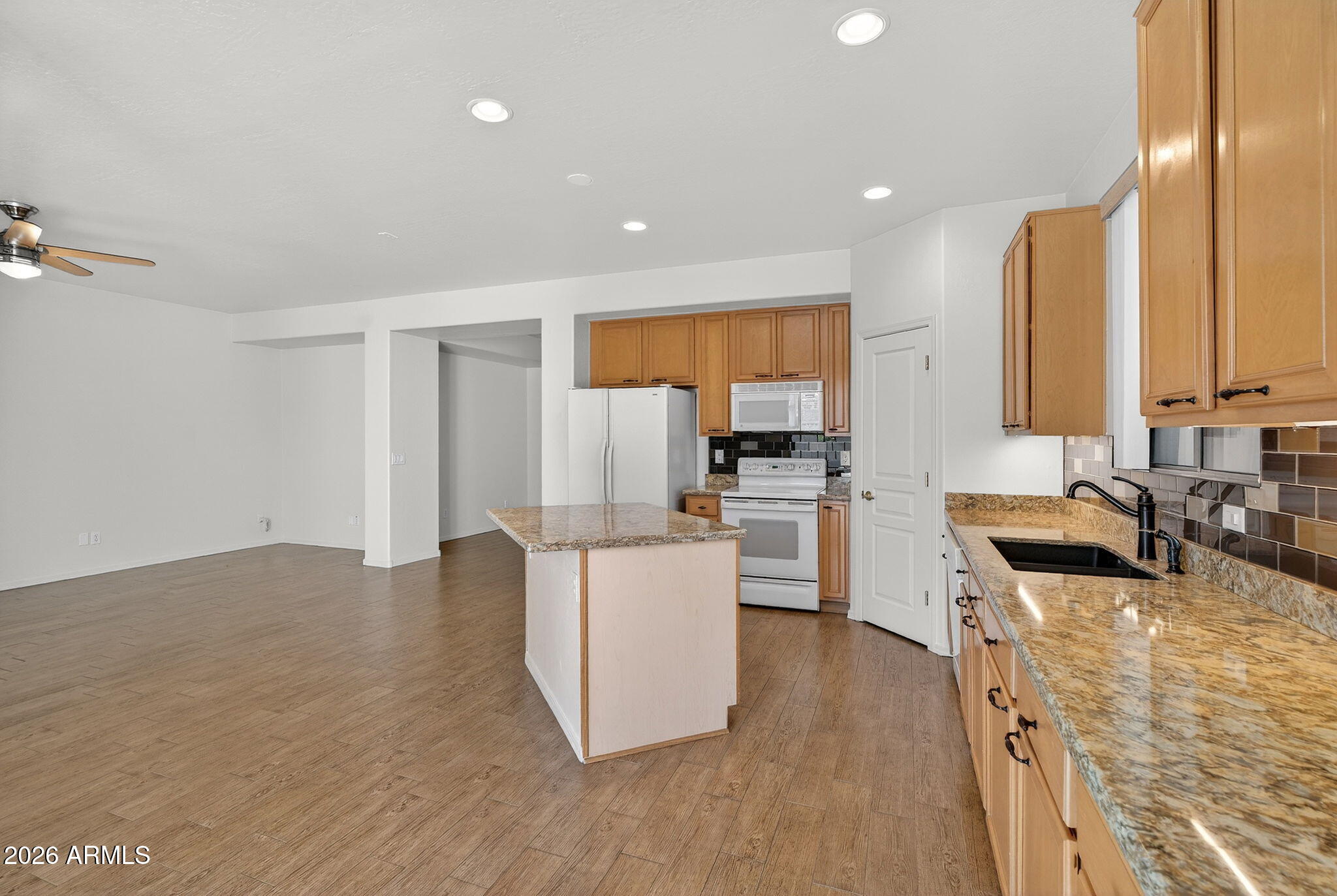 8217 West Bloomfield Road Peoria, AZ 85381 - Photo 11 of 48 a kitchen with refrigerator and cabinets