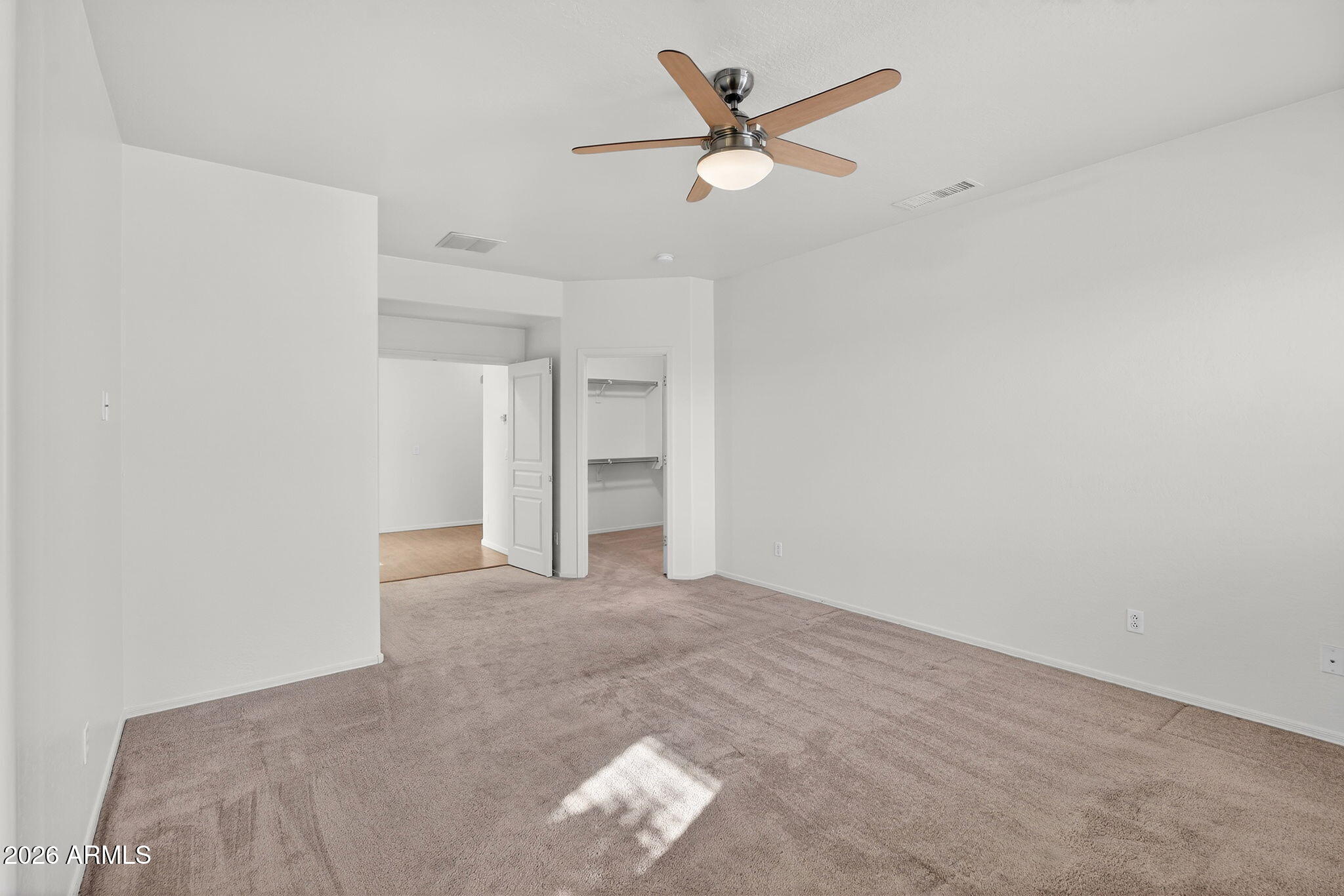 8217 West Bloomfield Road Peoria, AZ 85381 - Photo 17 of 48 an empty room with closet and fan