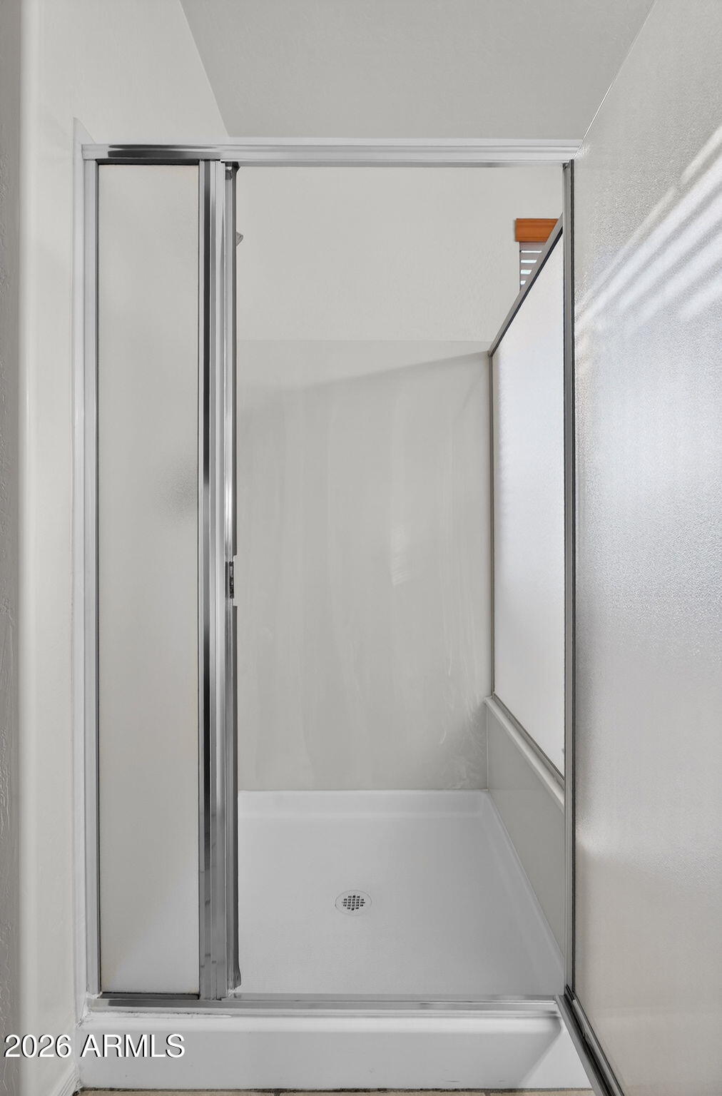 8217 West Bloomfield Road Peoria, AZ 85381 - Photo 22 of 48 a bathroom with a glass shower door