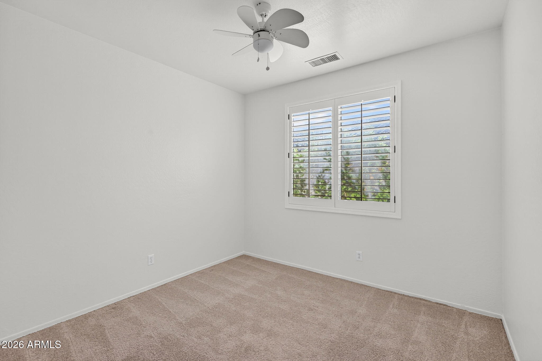 8217 West Bloomfield Road Peoria, AZ 85381 - Photo 28 of 48 an empty room with a window