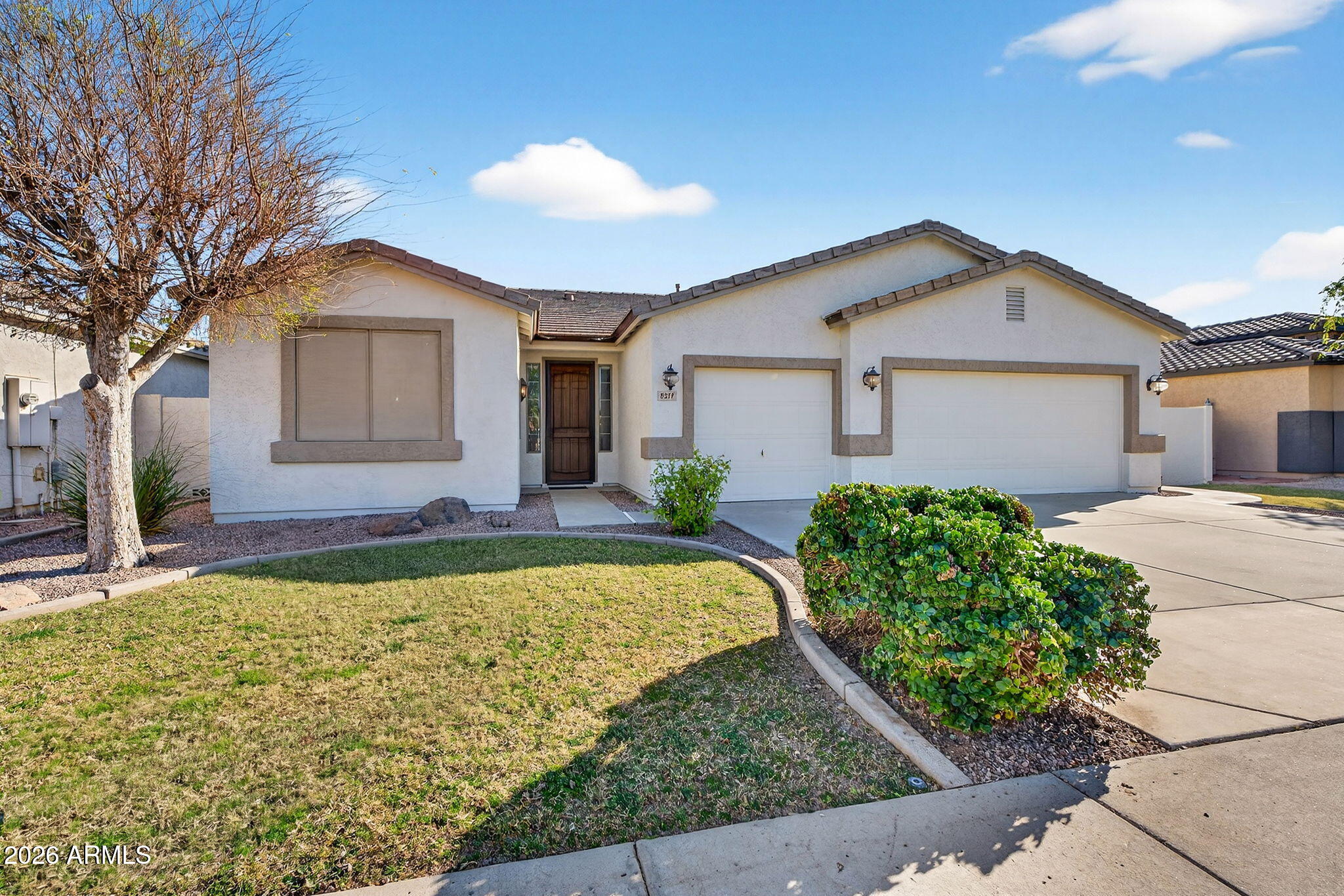 8217 West Bloomfield Road Peoria, AZ 85381 - Photo 2 of 48 a front view of a house with garden