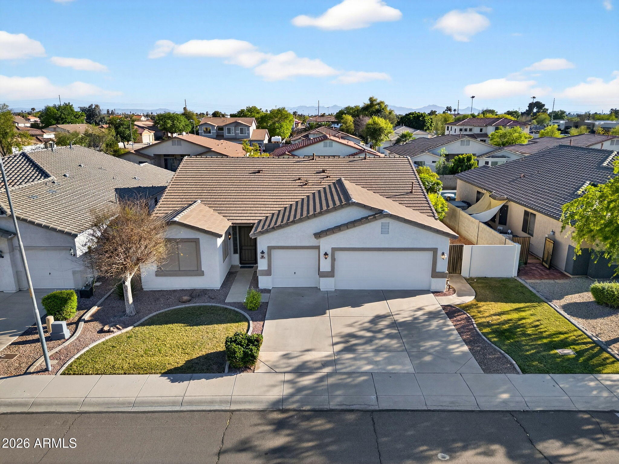8217 West Bloomfield Road Peoria, AZ 85381 - Photo 37 of 48 an aerial view of a house with a yard and potted plants