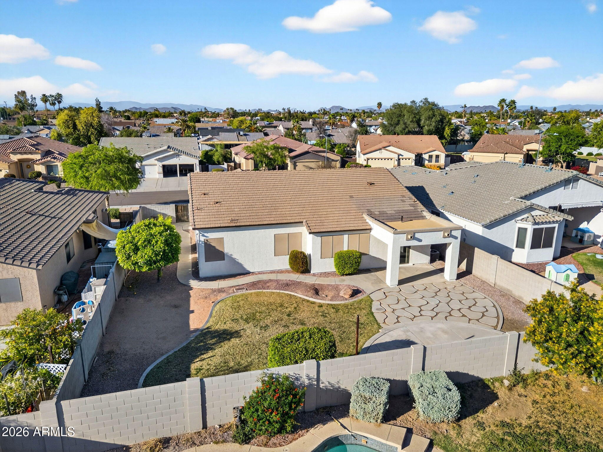 8217 West Bloomfield Road Peoria, AZ 85381 - Photo 41 of 48 an aerial view of a house with plants and large trees
