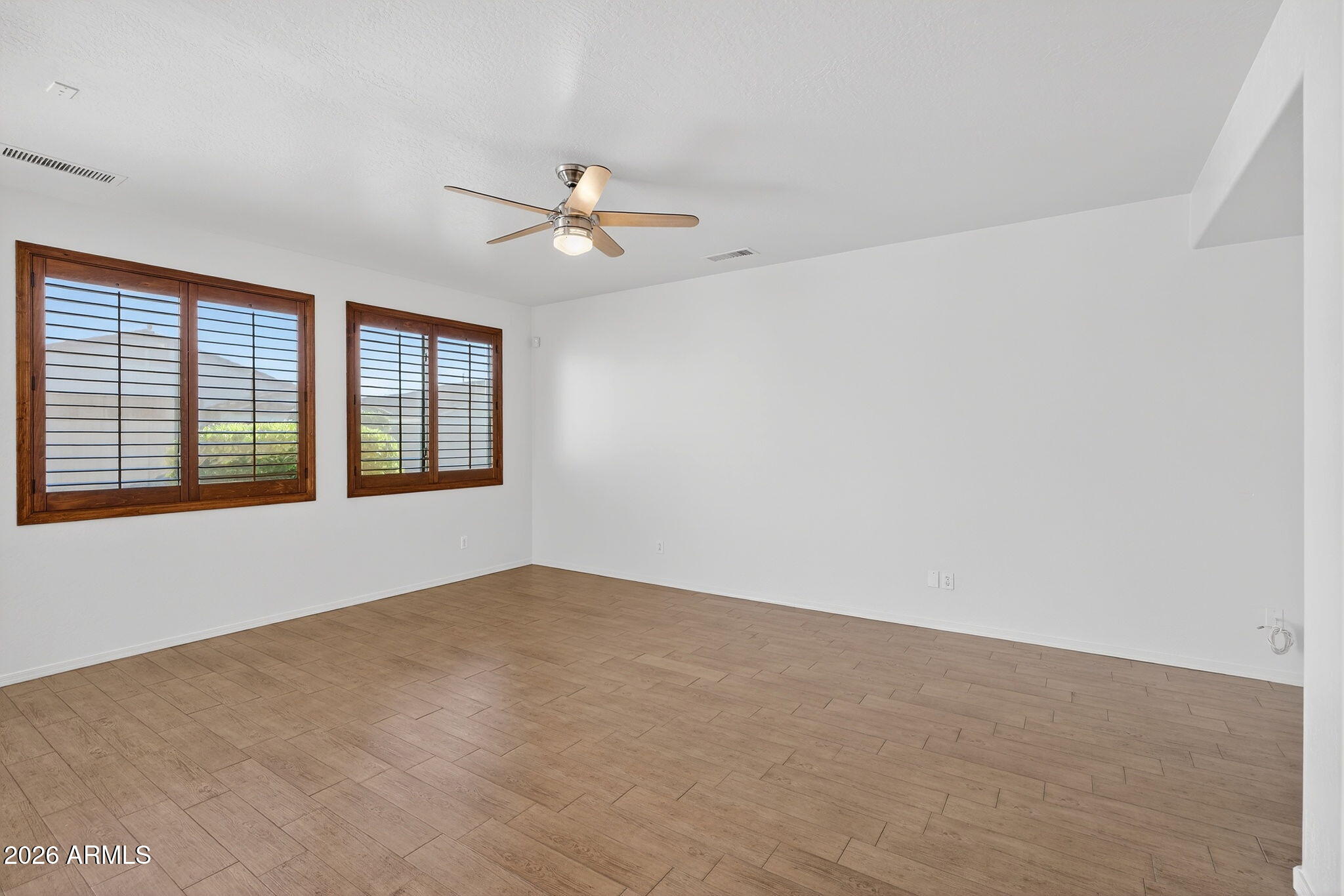 8217 West Bloomfield Road Peoria, AZ 85381 - Photo 4 of 48 a view of an empty room with a window