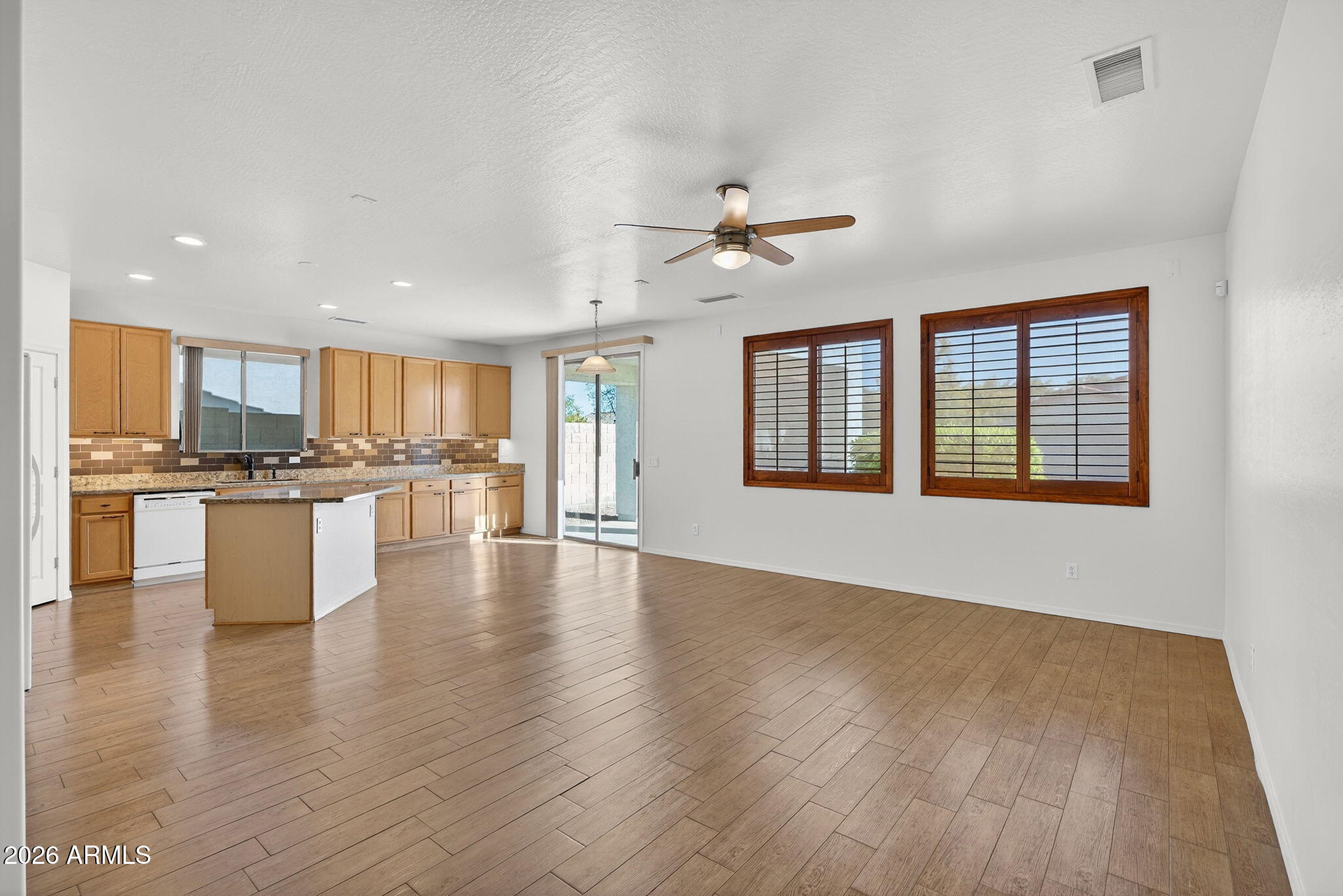 8217 West Bloomfield Road Peoria, AZ 85381 - Photo 7 of 48 a view of an empty room with kitchen appliances and a window