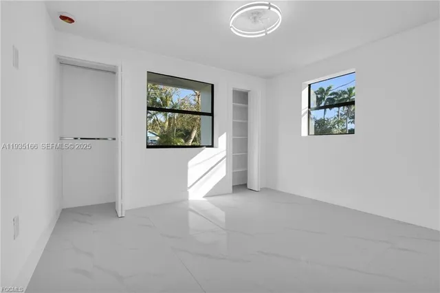 an empty room with windows