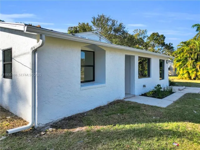 a backyard of a house with lots of green space