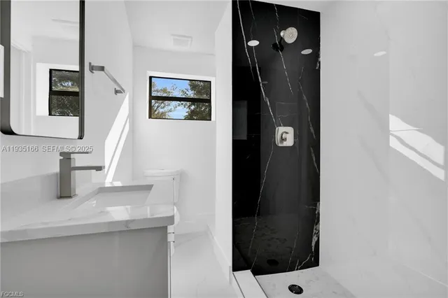 a bathroom with a sink and mirror