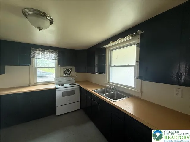 a kitchen filled counter top space and a sink