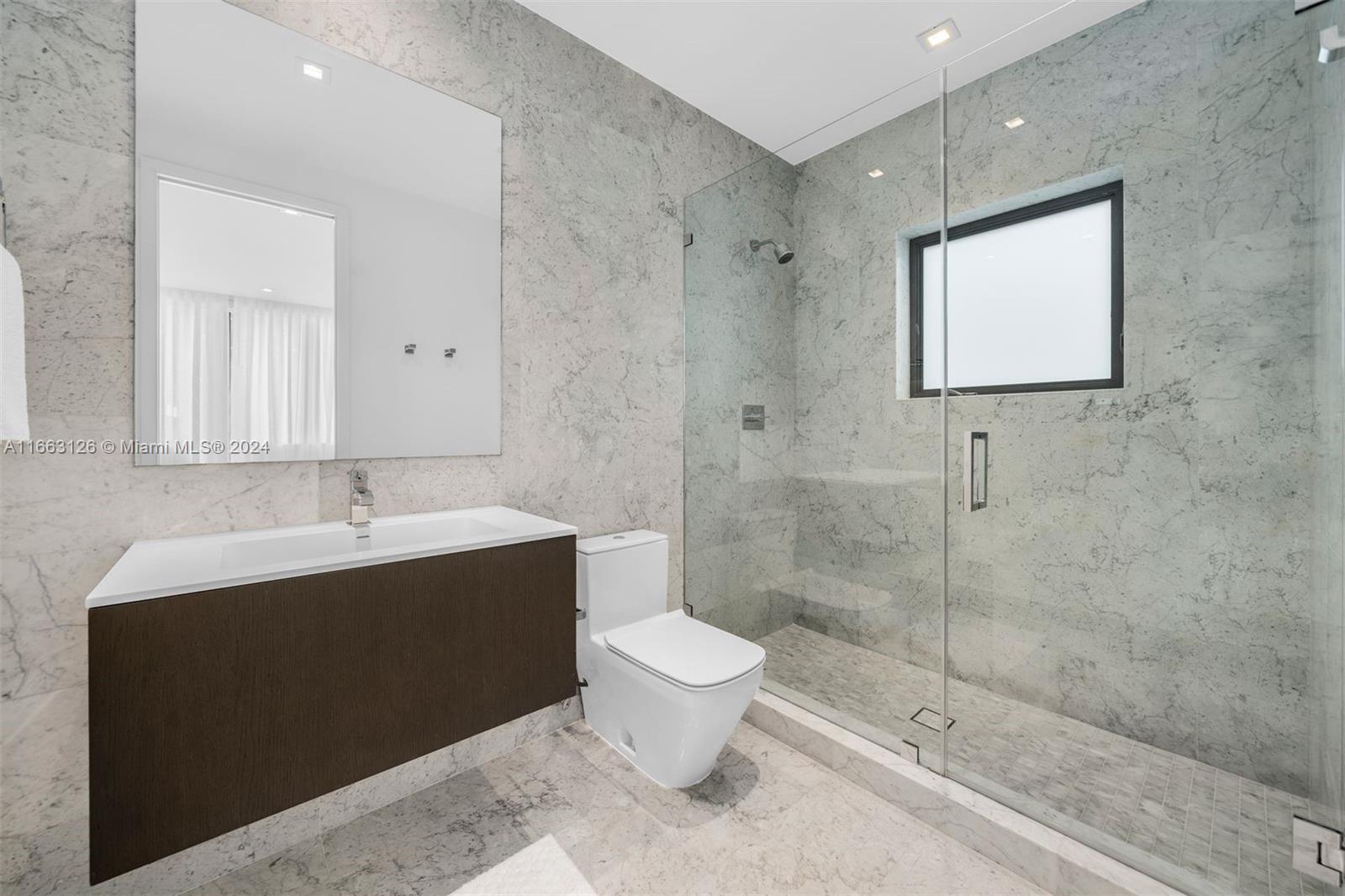 5327 North Bay Road Miami Beach, FL 33140 - Photo 29 of 37 a bathroom with a sink toilet and shower