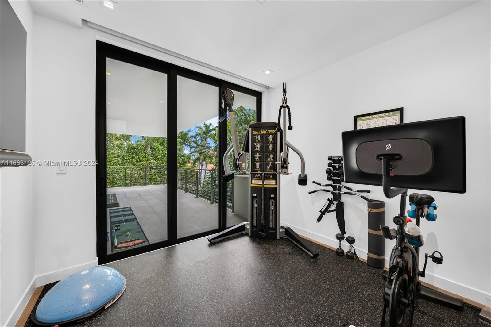 5327 North Bay Road Miami Beach, FL 33140 - Photo 33 of 37 a view of a workspace with furniture and a gate