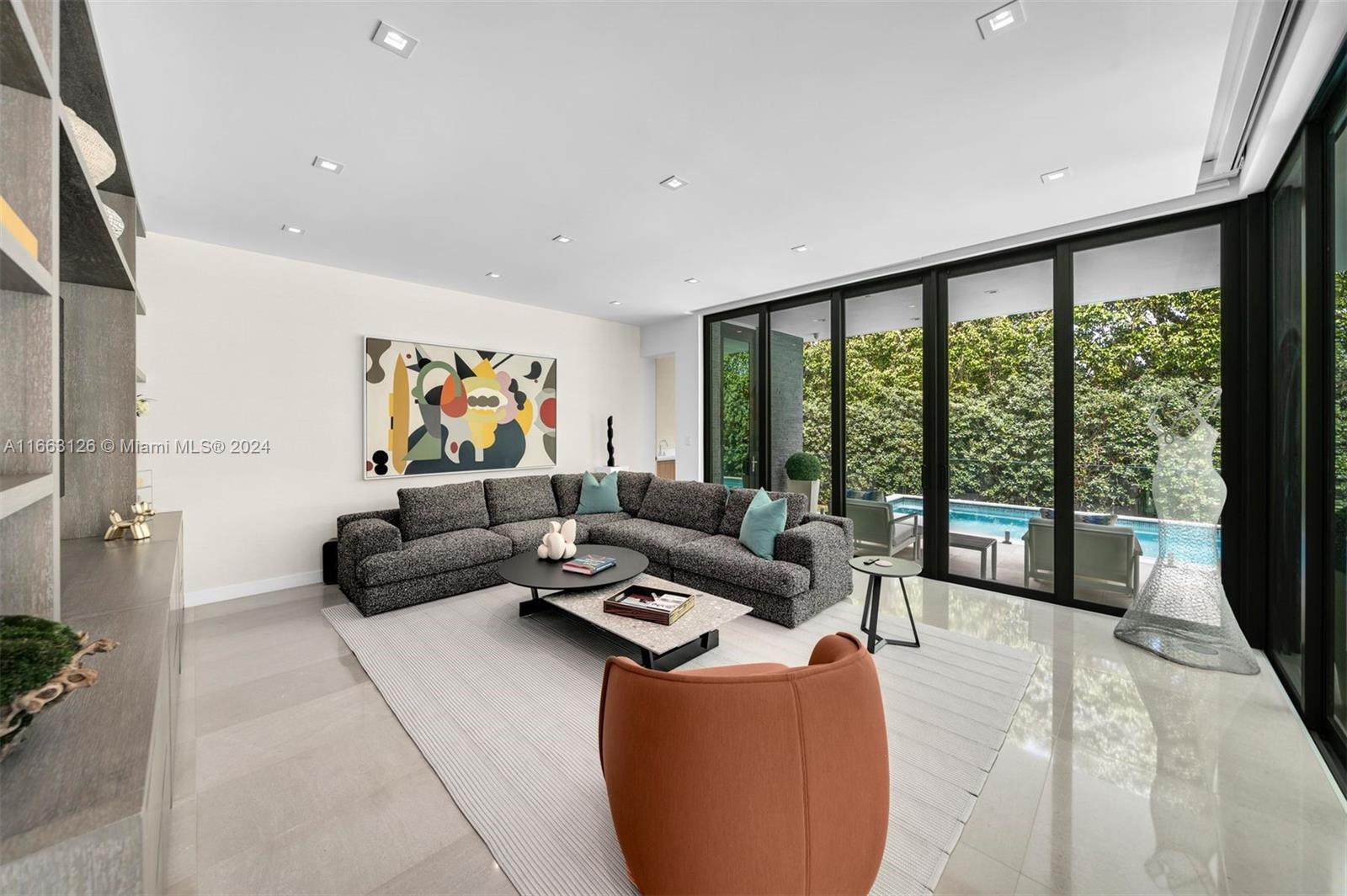 5327 North Bay Road Miami Beach, FL 33140 - Photo 4 of 37 a living room with furniture and a large window
