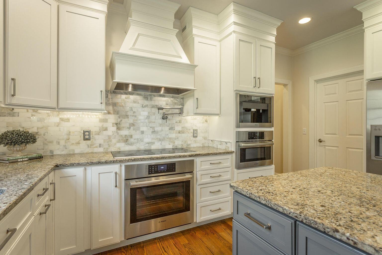 9619 Windrose Circle Chattanooga, TN 37421 - Photo 19 of 69 a kitchen with stainless steel appliances granite countertop a stove and cabinets