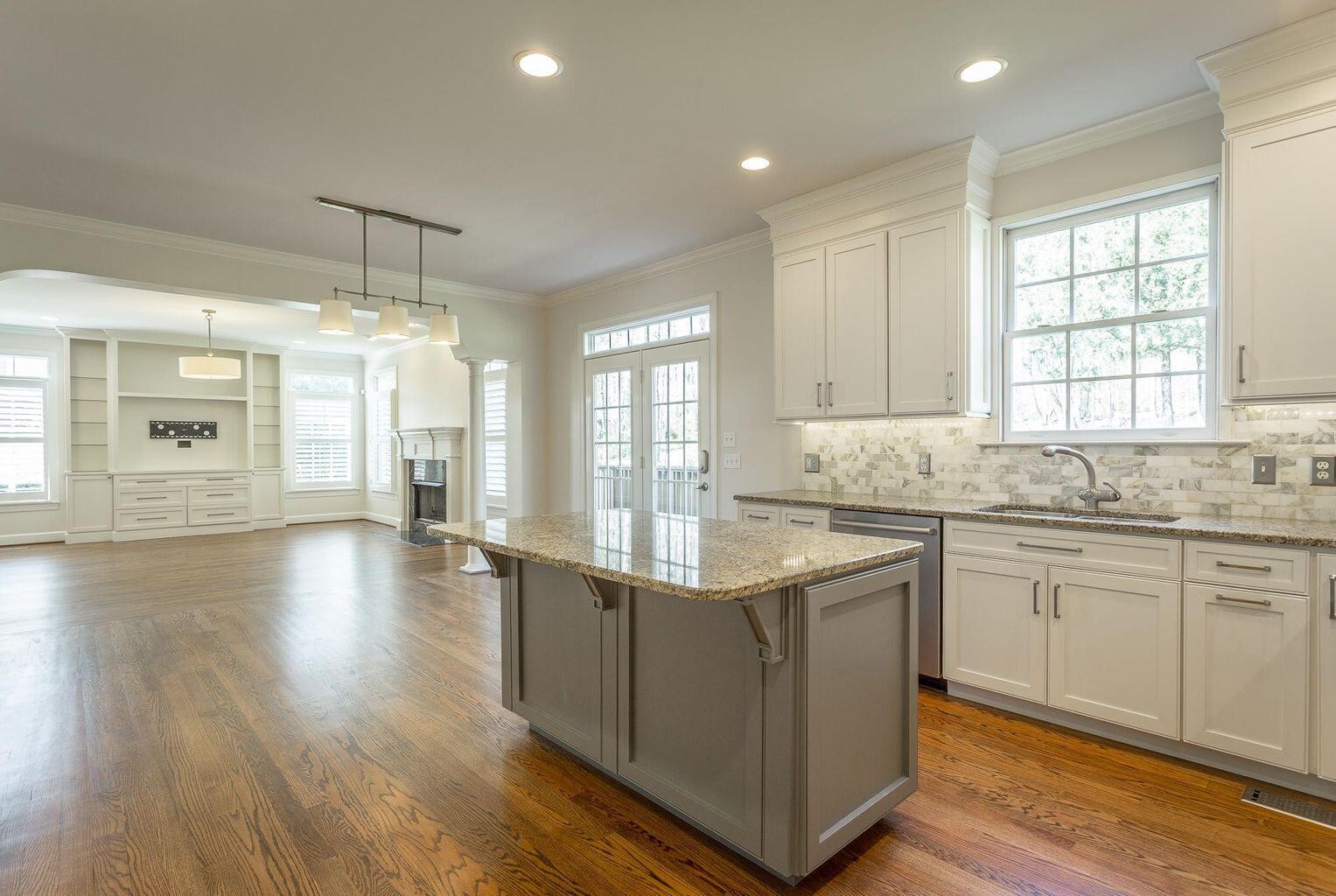 9619 Windrose Circle Chattanooga, TN 37421 - Photo 20 of 69 a kitchen with stainless steel appliances granite countertop a sink cabinets and wooden floor