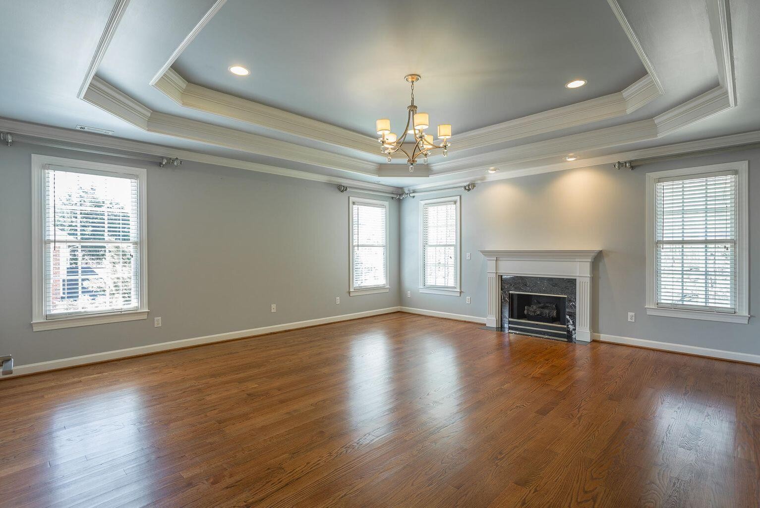 9619 Windrose Circle Chattanooga, TN 37421 - Photo 33 of 69 an empty room with wooden floor fireplace and windows