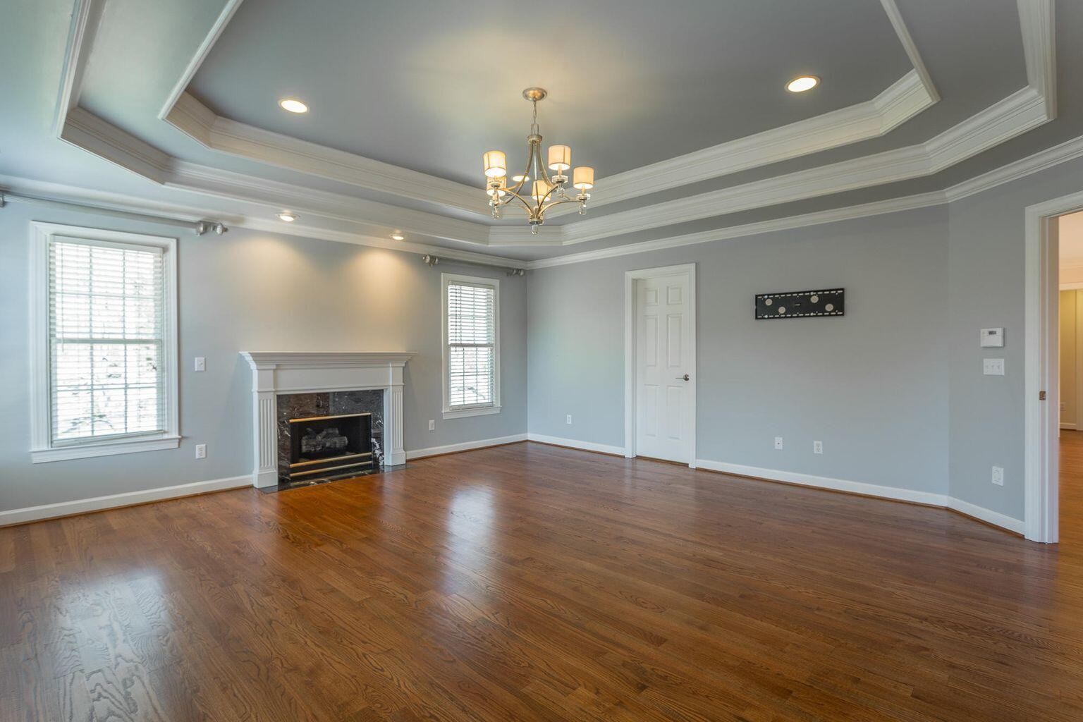 9619 Windrose Circle Chattanooga, TN 37421 - Photo 35 of 69 an empty room with wooden floor fireplace and windows