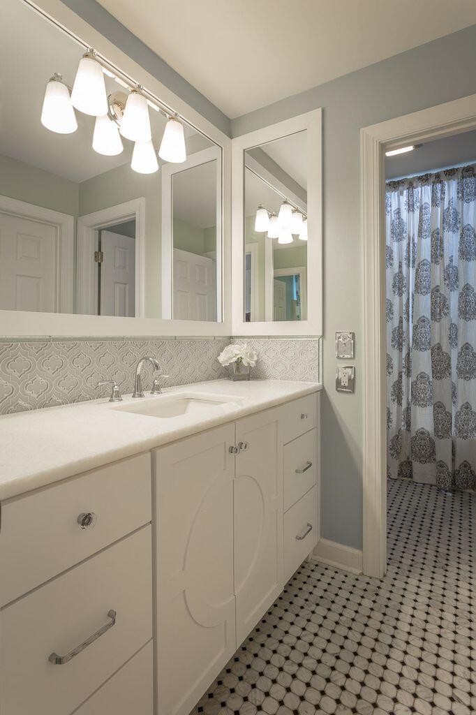 9619 Windrose Circle Chattanooga, TN 37421 - Photo 46 of 69 a spacious bathroom with a shower sink and mirror