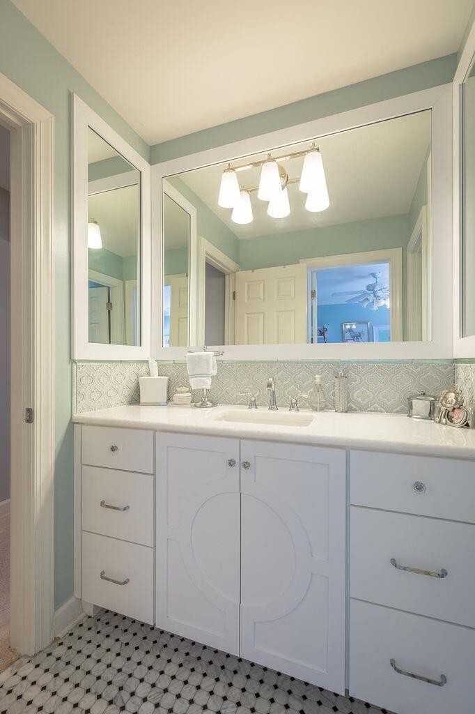 9619 Windrose Circle Chattanooga, TN 37421 - Photo 47 of 69 a bathroom with a sink a vanity and a mirror