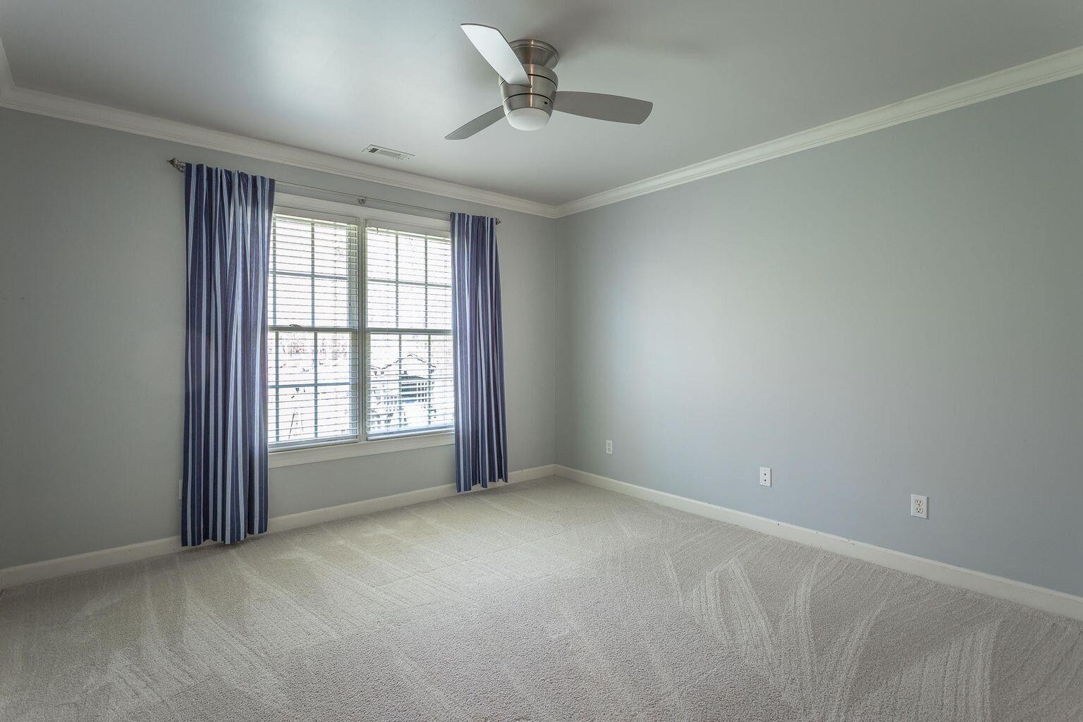 9619 Windrose Circle Chattanooga, TN 37421 - Photo 54 of 69 an empty room with a window and a ceiling fan