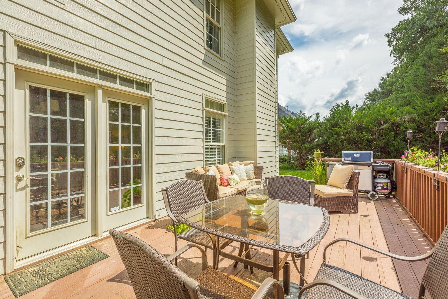 9619 Windrose Circle Chattanooga, TN 37421 - Photo 57 of 69 a view of a patio with a dining table and chairs