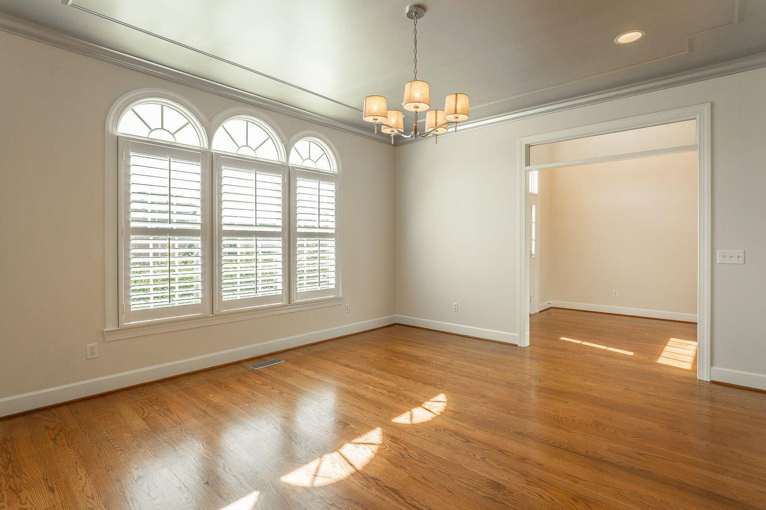 9619 Windrose Circle Chattanooga, TN 37421 - Photo 6 of 69 a view of an empty room with wooden floor and a window