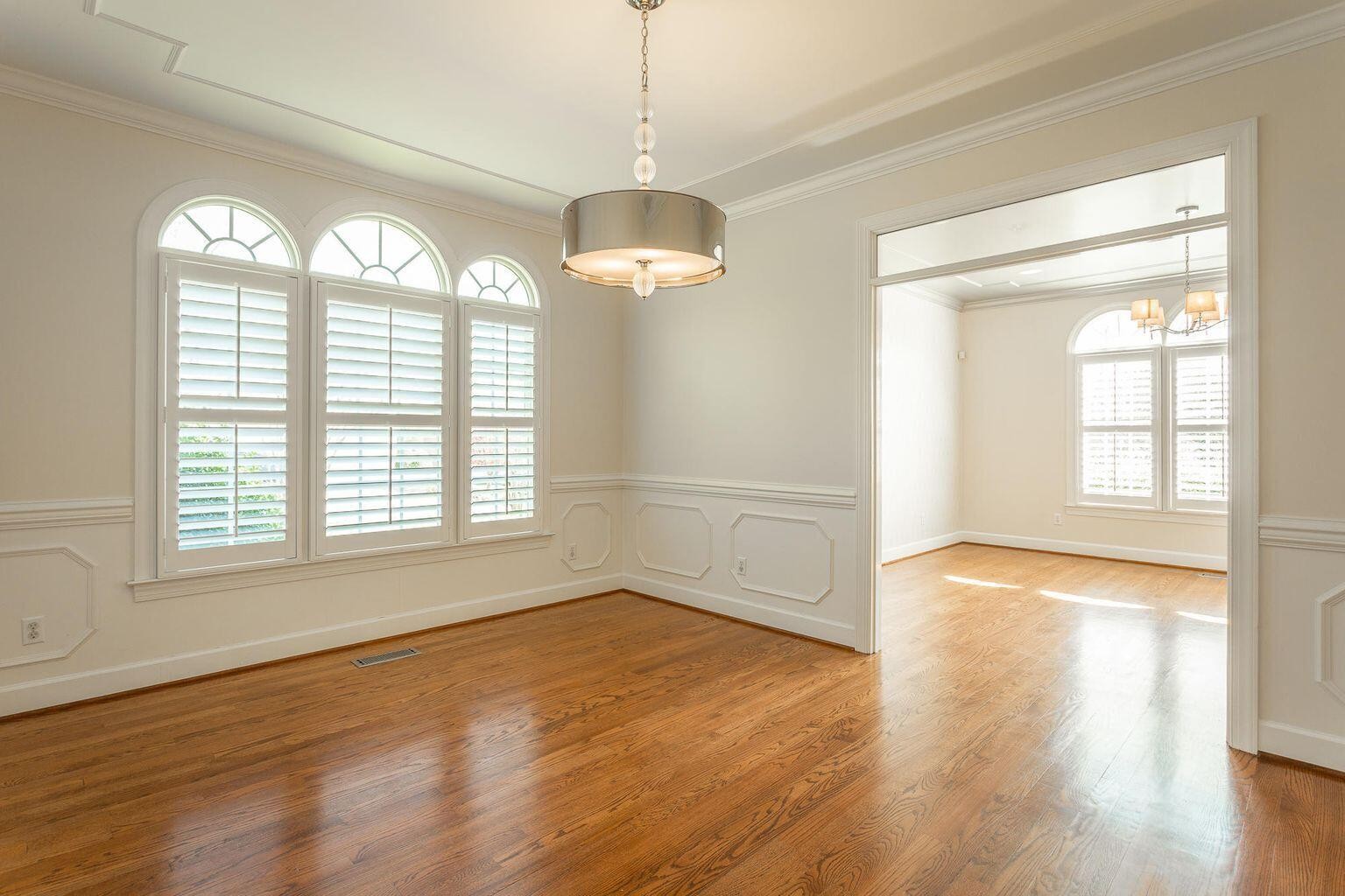 9619 Windrose Circle Chattanooga, TN 37421 - Photo 9 of 69 a view of an empty room with wooden floor and a window