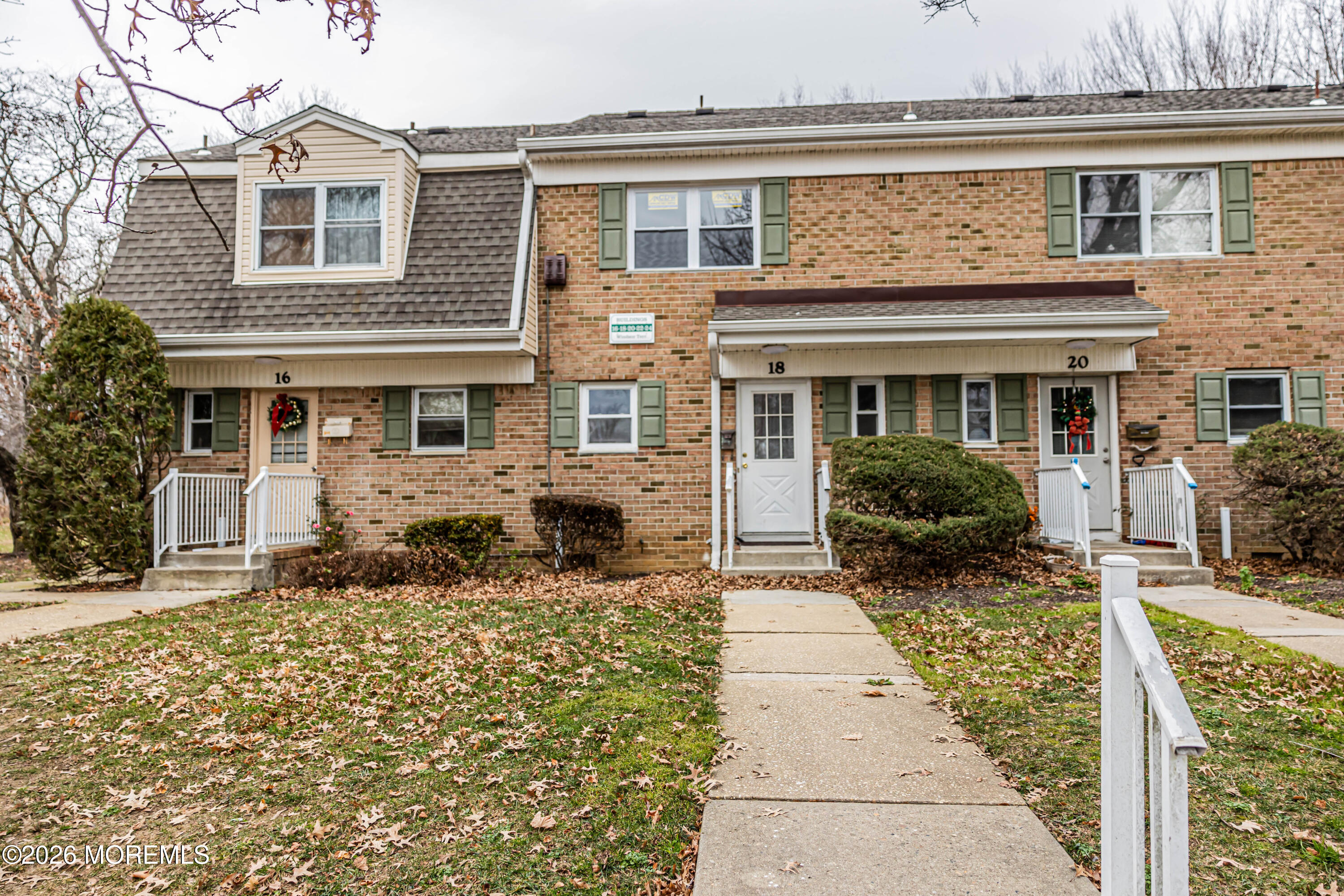 18 Windsor Terrace, Unit 18 Freehold, NJ 07728 - Photo 1 of 37 a front view of a house with garden