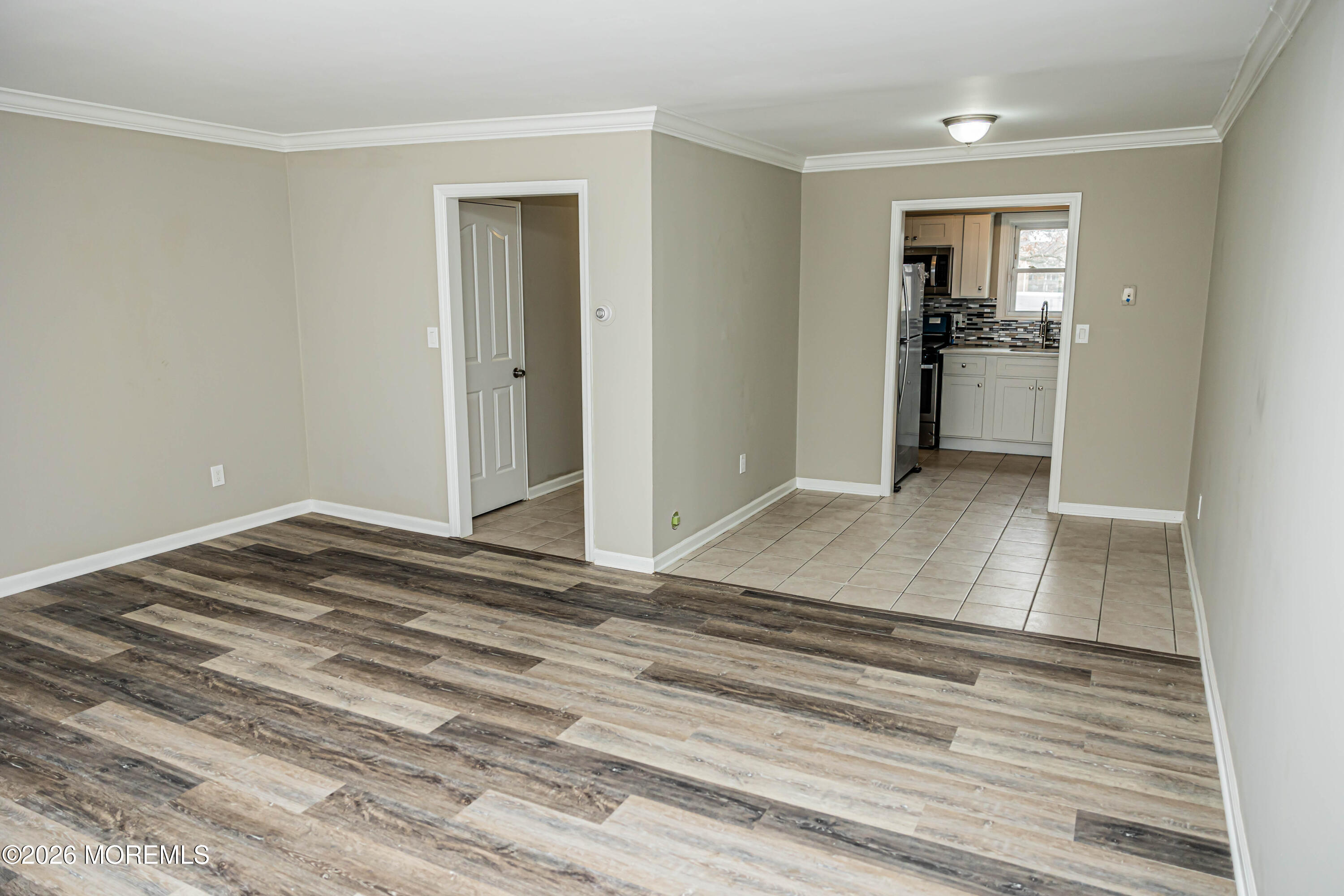 18 Windsor Terrace, Unit 18 Freehold, NJ 07728 - Photo 12 of 37 a view of a room with a furniture and wooden floor