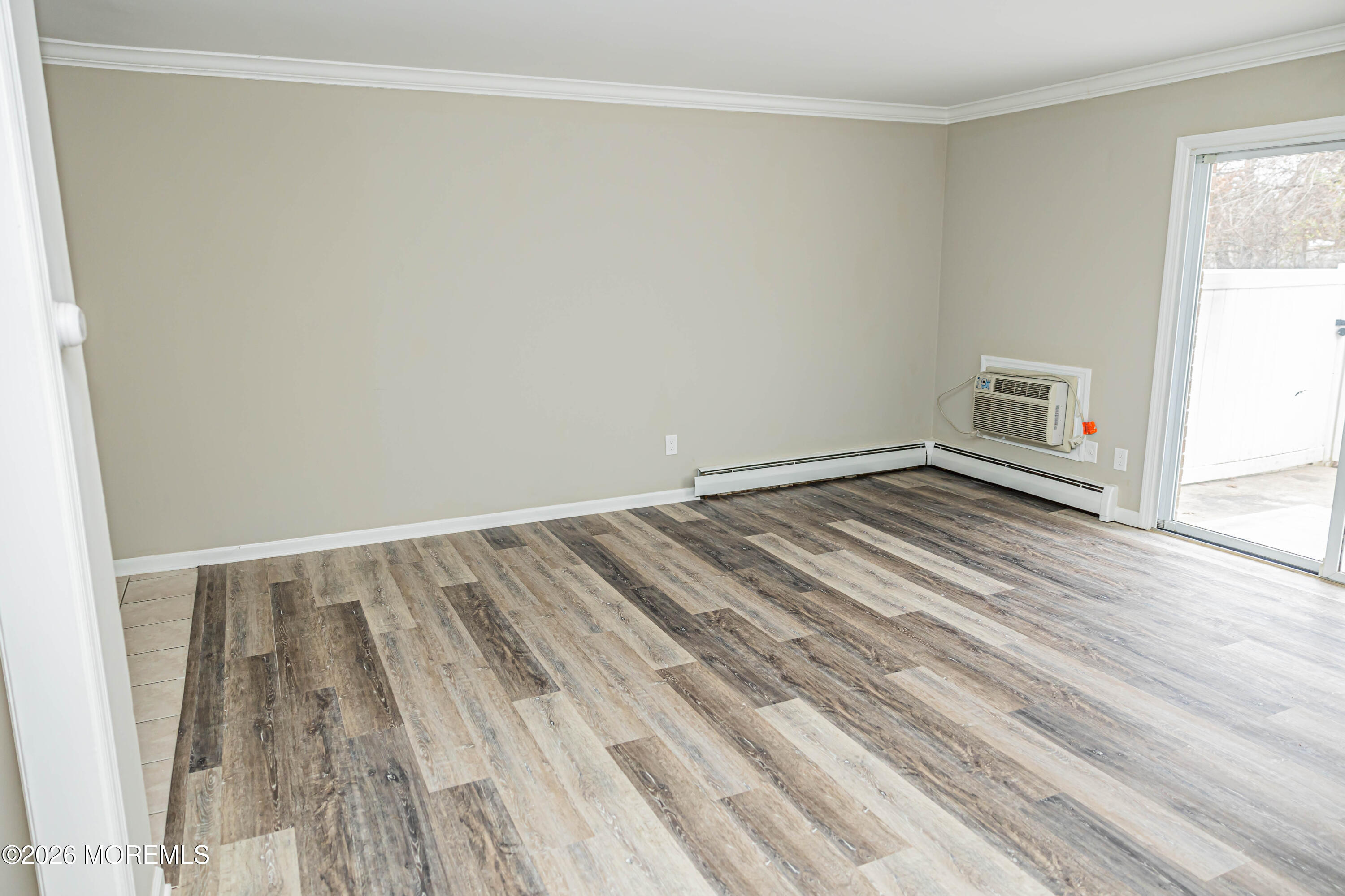 18 Windsor Terrace, Unit 18 Freehold, NJ 07728 - Photo 14 of 37 a view of empty room with wooden floor