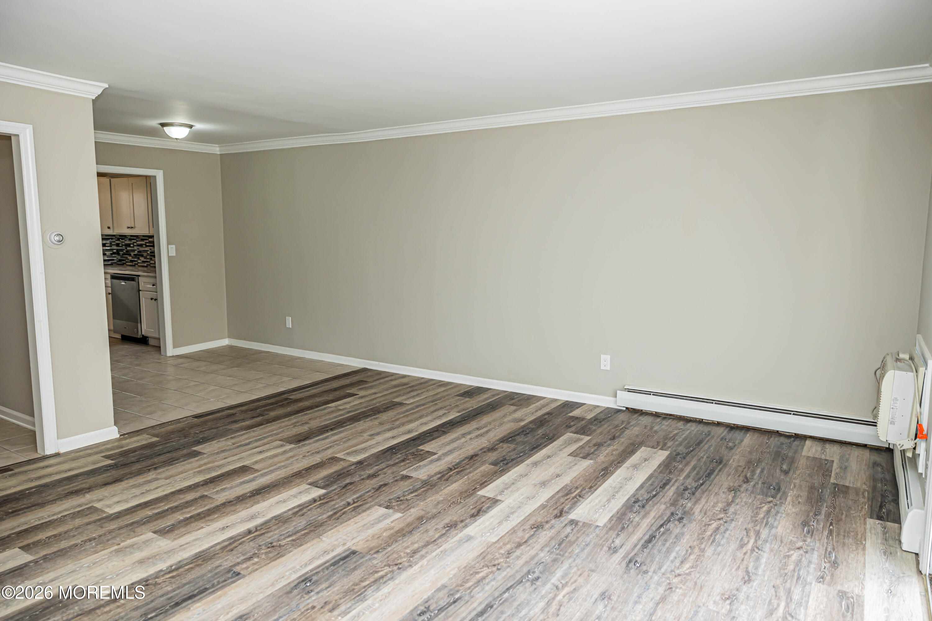 18 Windsor Terrace, Unit 18 Freehold, NJ 07728 - Photo 15 of 37 a view of a room with wooden floor