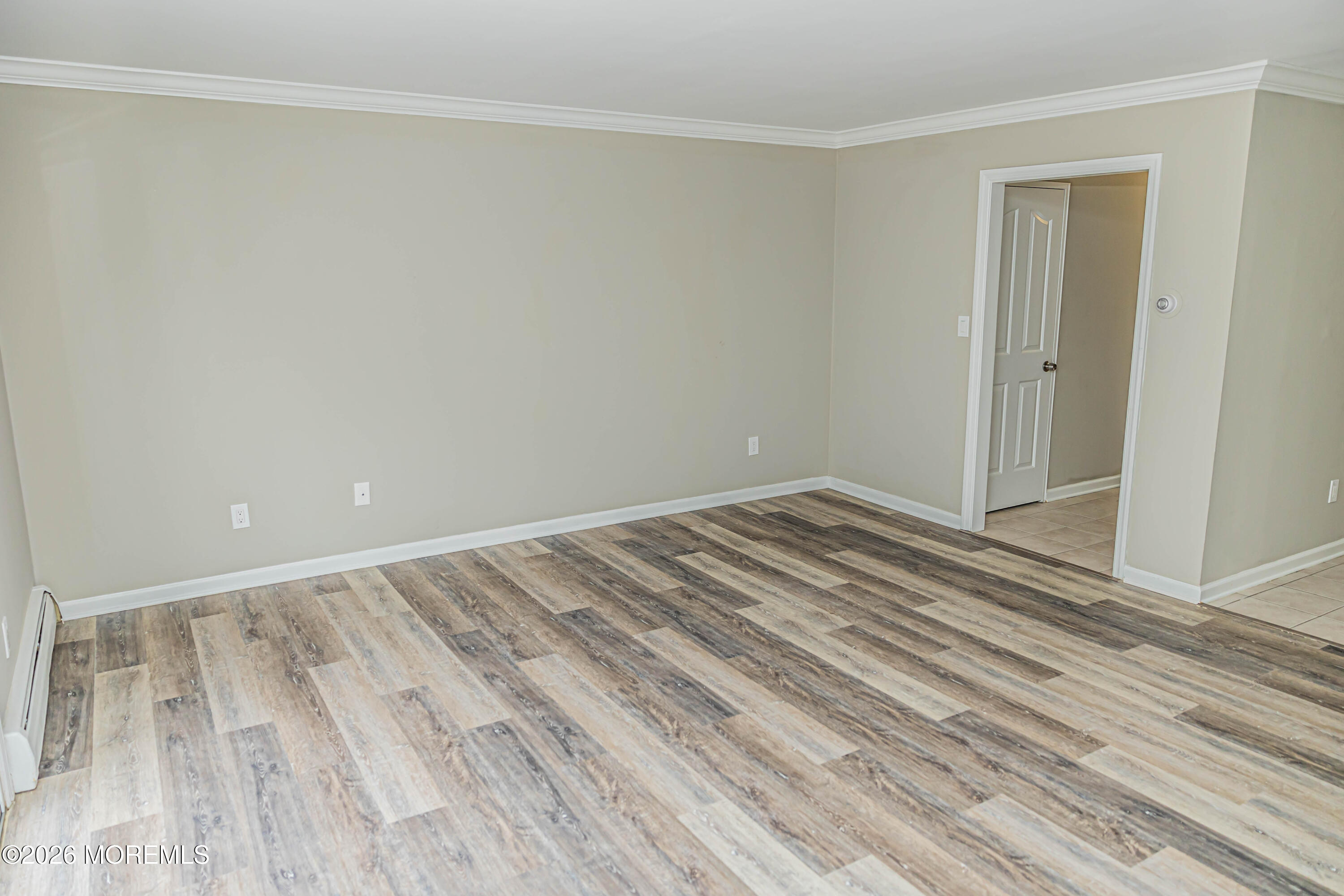 18 Windsor Terrace, Unit 18 Freehold, NJ 07728 - Photo 16 of 37 a view of room with wooden floor