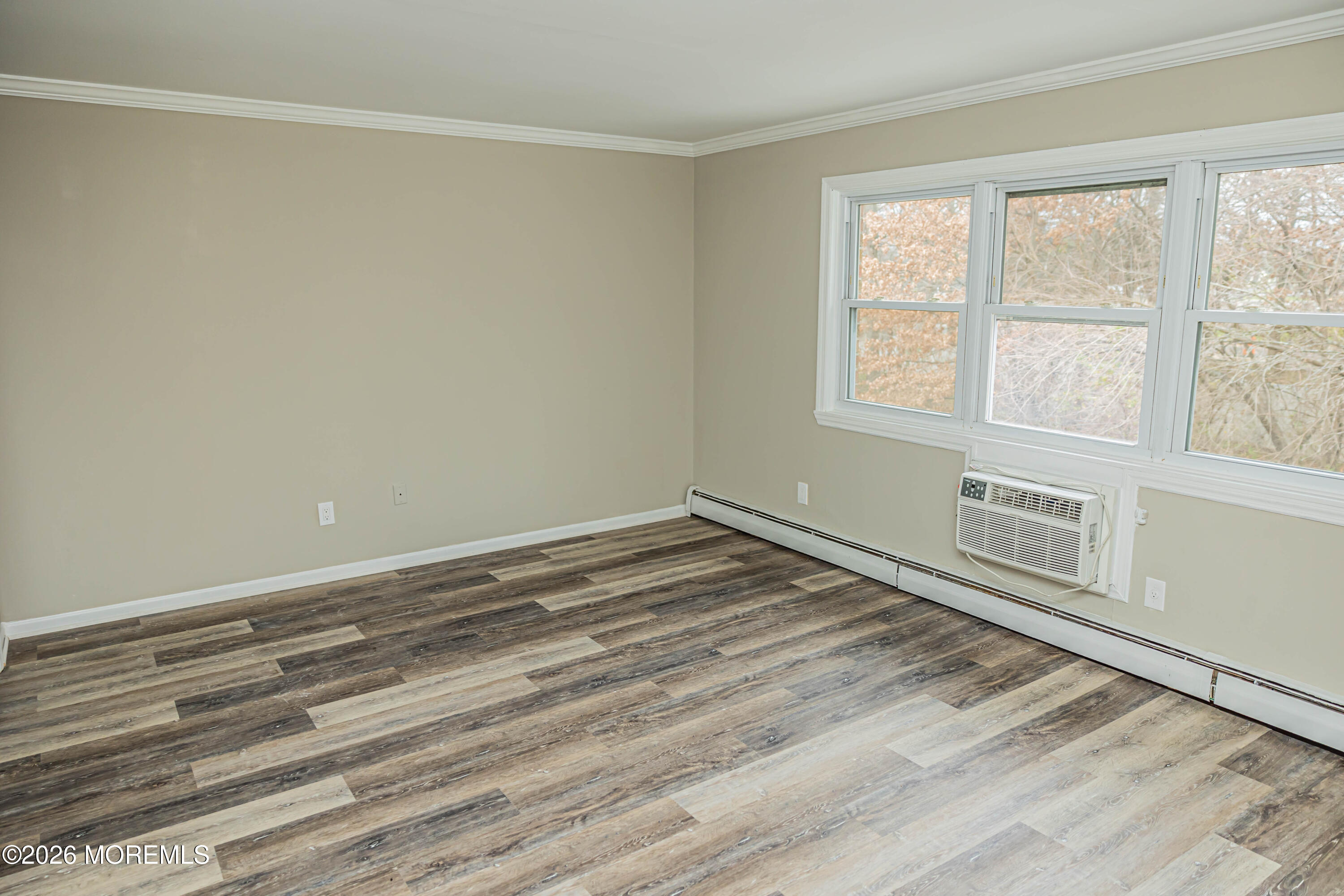 18 Windsor Terrace, Unit 18 Freehold, NJ 07728 - Photo 19 of 37 a view of a room with wooden floor and windows