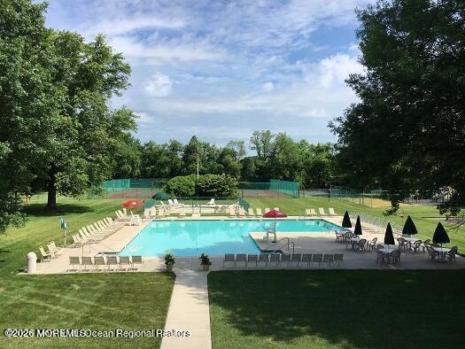 18 Windsor Terrace, Unit 18 Freehold, NJ 07728 - Photo 2 of 37 a view of a swimming pool and a yard