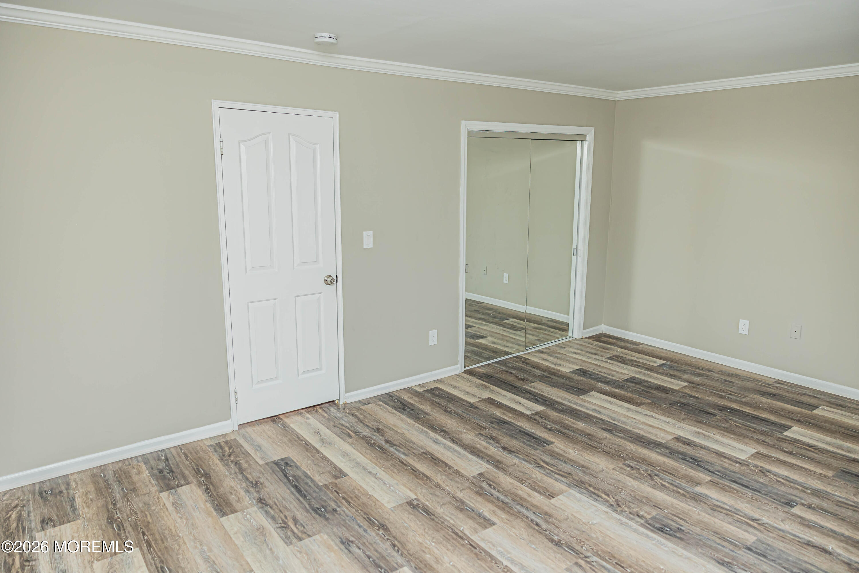 18 Windsor Terrace, Unit 18 Freehold, NJ 07728 - Photo 23 of 37 a view of a room with wooden floor
