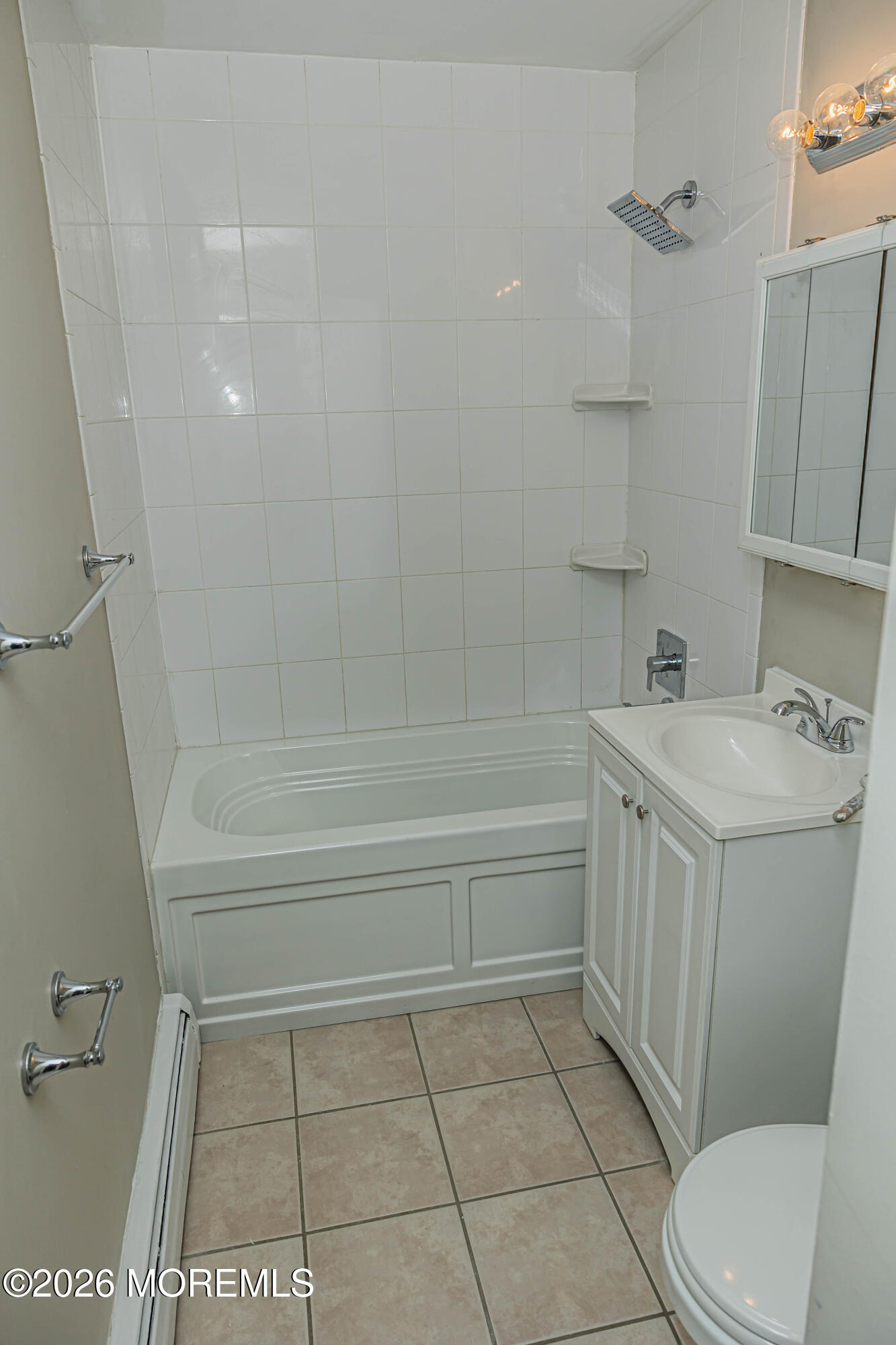 18 Windsor Terrace, Unit 18 Freehold, NJ 07728 - Photo 26 of 37 a bathroom with a sink a toilet and shower