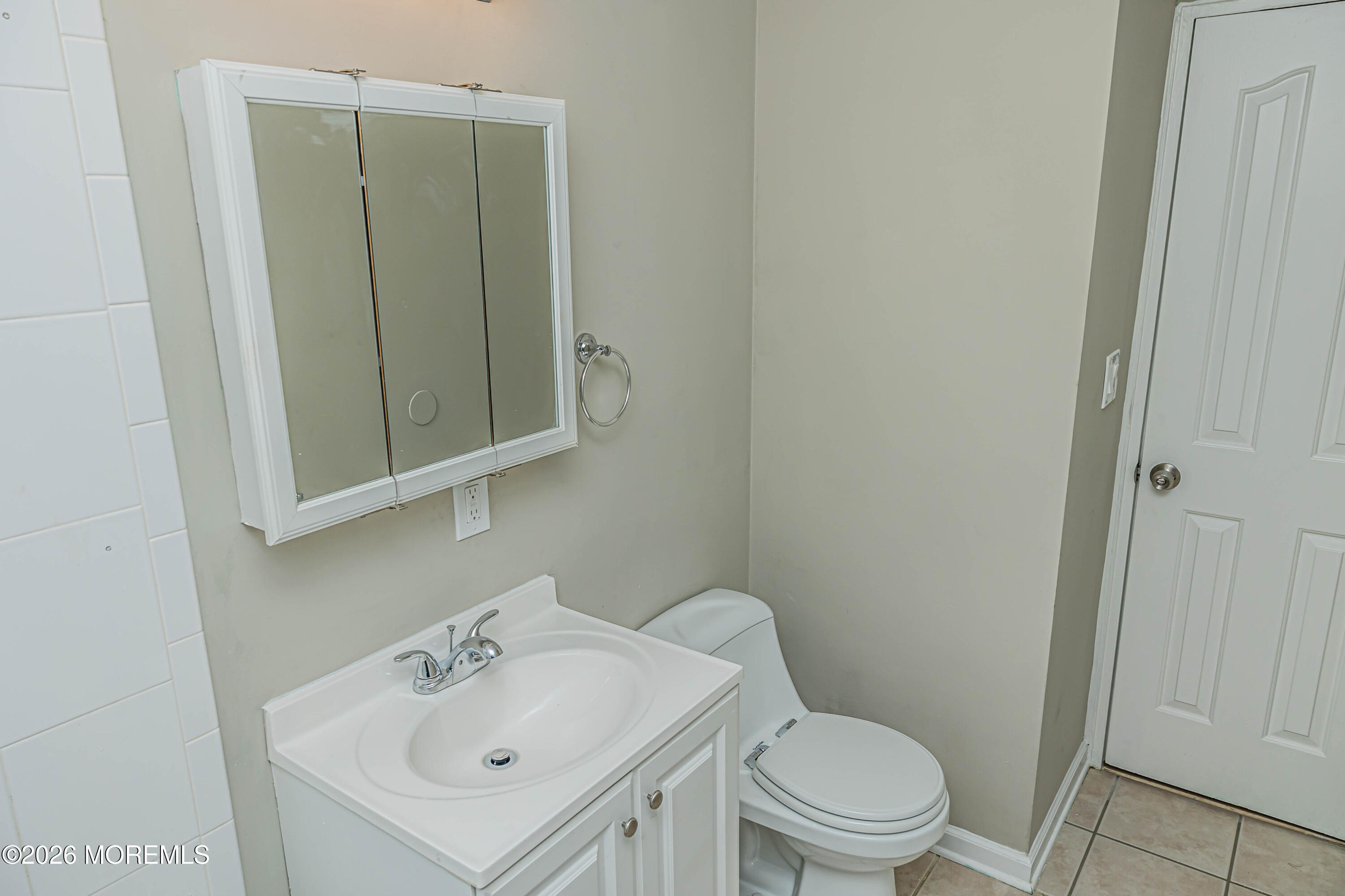 18 Windsor Terrace, Unit 18 Freehold, NJ 07728 - Photo 27 of 37 a bathroom with a sink a toilet and shower