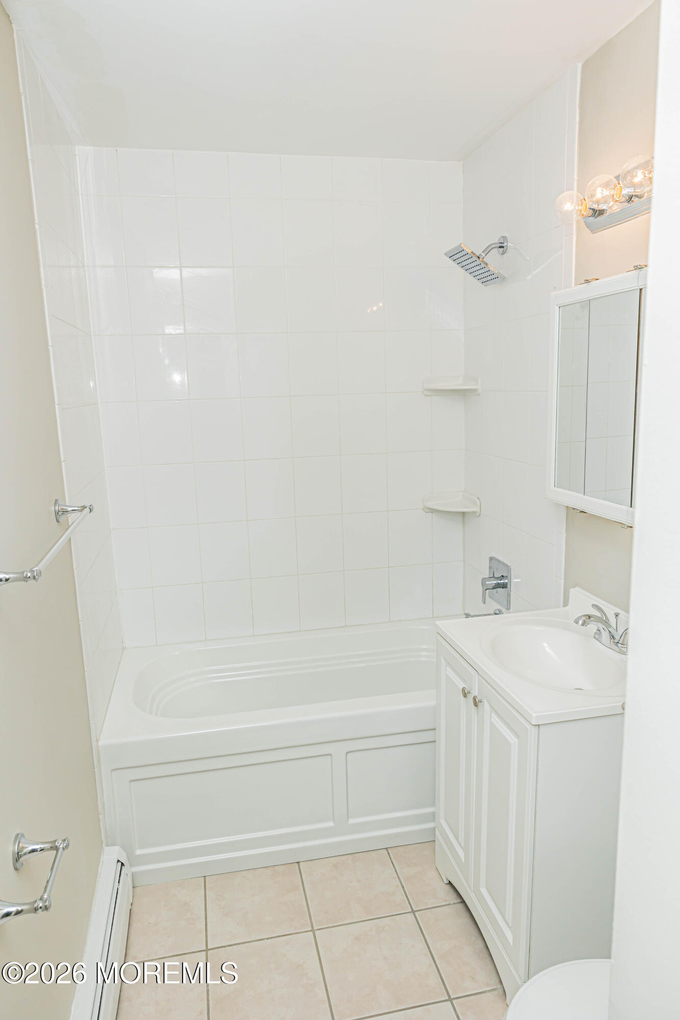 18 Windsor Terrace, Unit 18 Freehold, NJ 07728 - Photo 28 of 37 a bathroom with a bathtub a sink a toilet and a shower