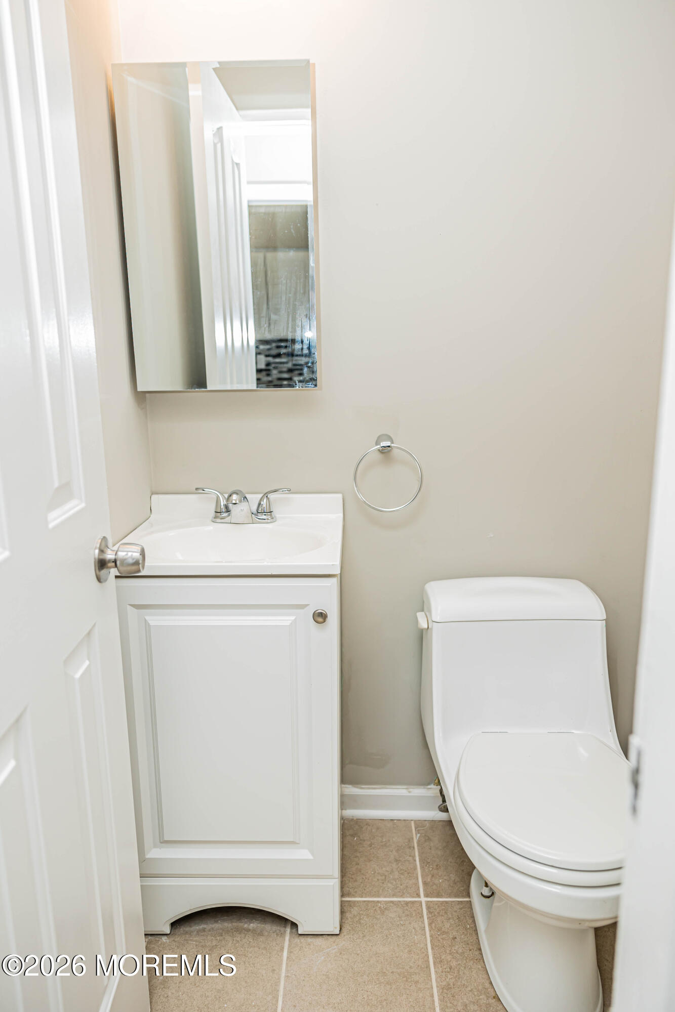 18 Windsor Terrace, Unit 18 Freehold, NJ 07728 - Photo 29 of 37 a bathroom with a toilet a sink and a mirror