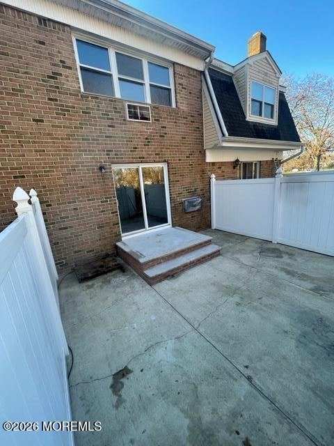 18 Windsor Terrace, Unit 18 Freehold, NJ 07728 - Photo 33 of 37 a front view of a house with a brick wall