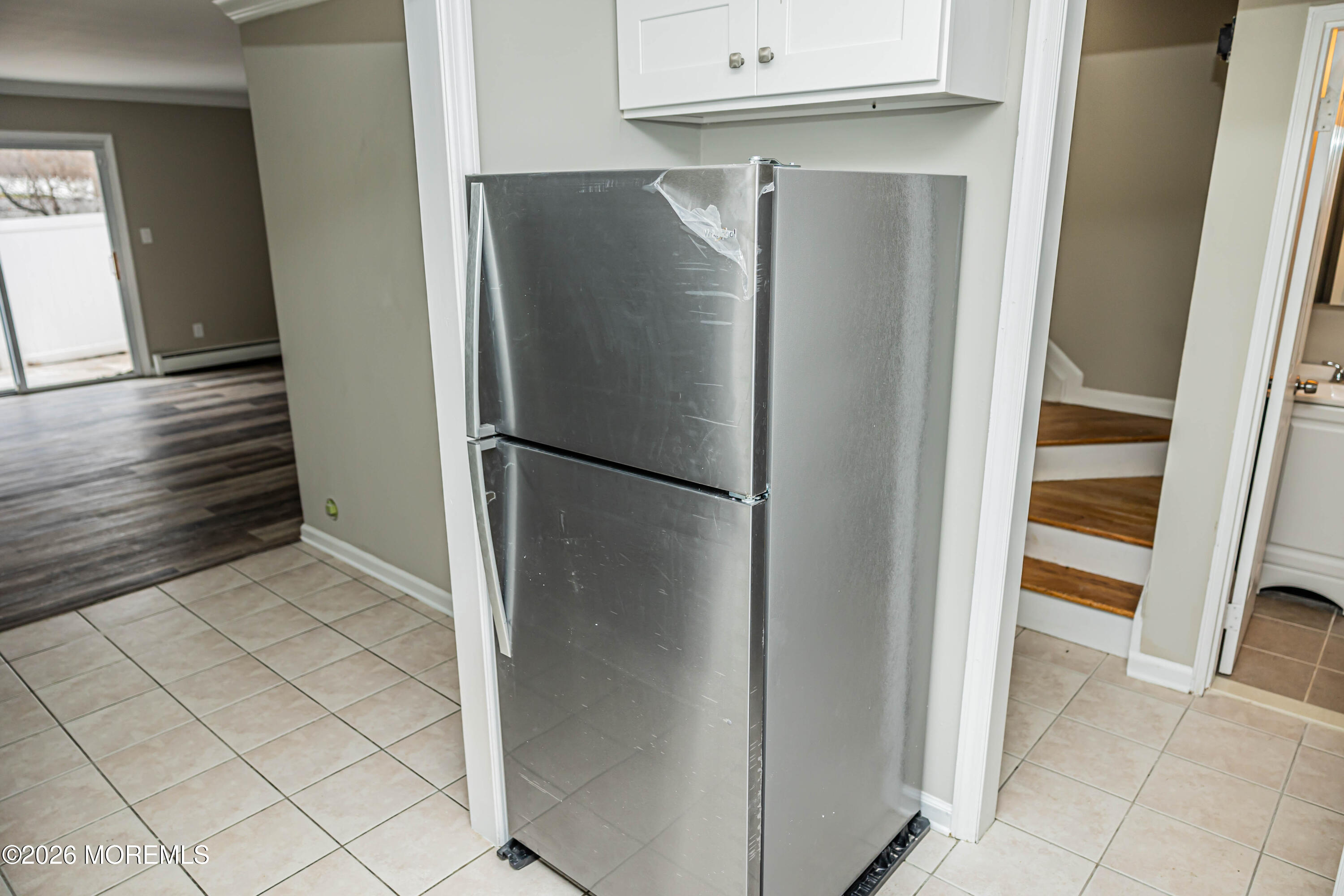 18 Windsor Terrace, Unit 18 Freehold, NJ 07728 - Photo 8 of 37 a refrigerator freezer sitting inside of a kitchen