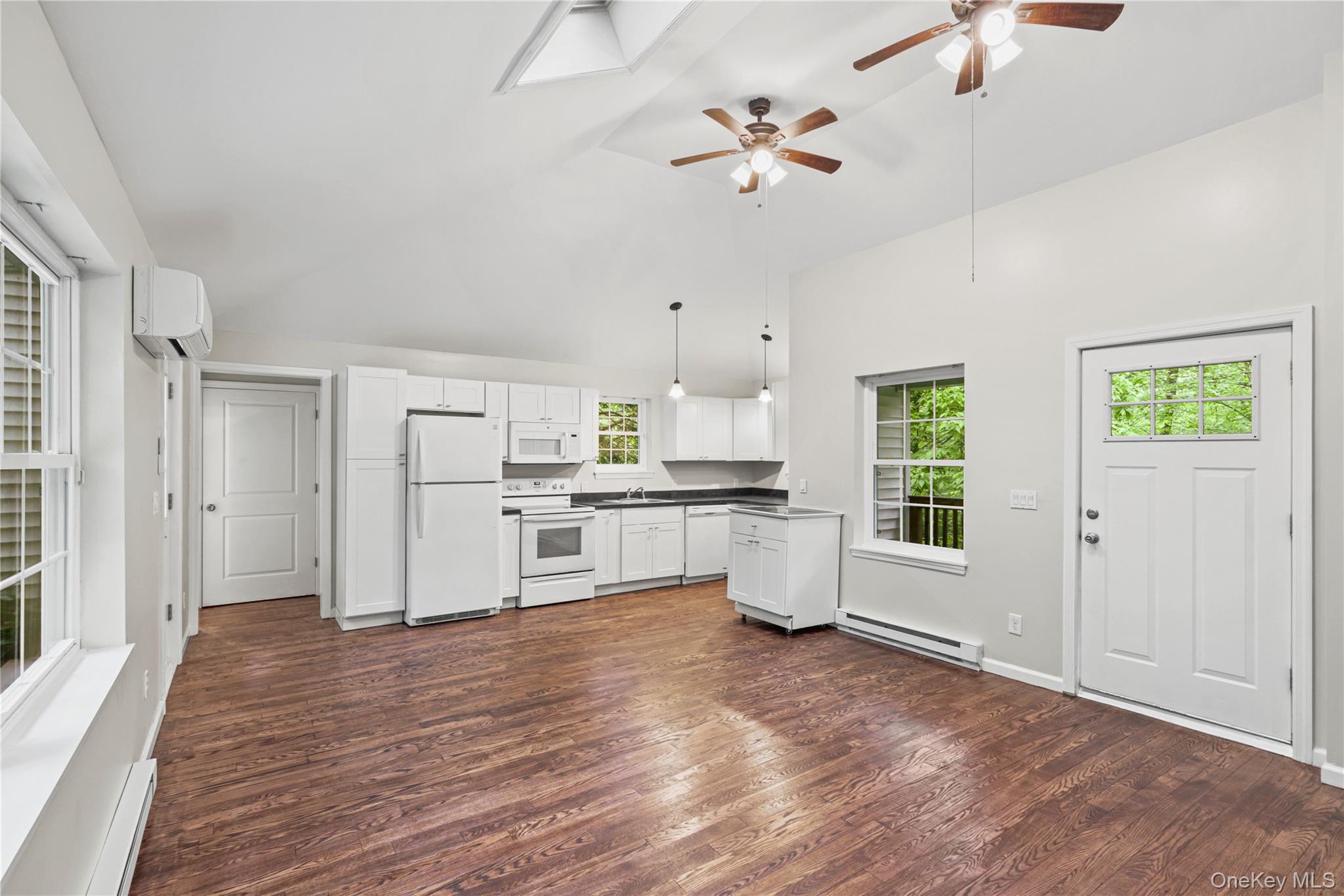 333 Wixon Pond Road Mahopac, NY 10541 - Photo 2 of 18 Open concept living featuring high vaulted ceiling with newly finished hardwood floors and ceiling fans.