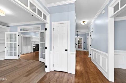 a kitchen with stainless steel appliances granite countertop a sink stove refrigerator and cabinets