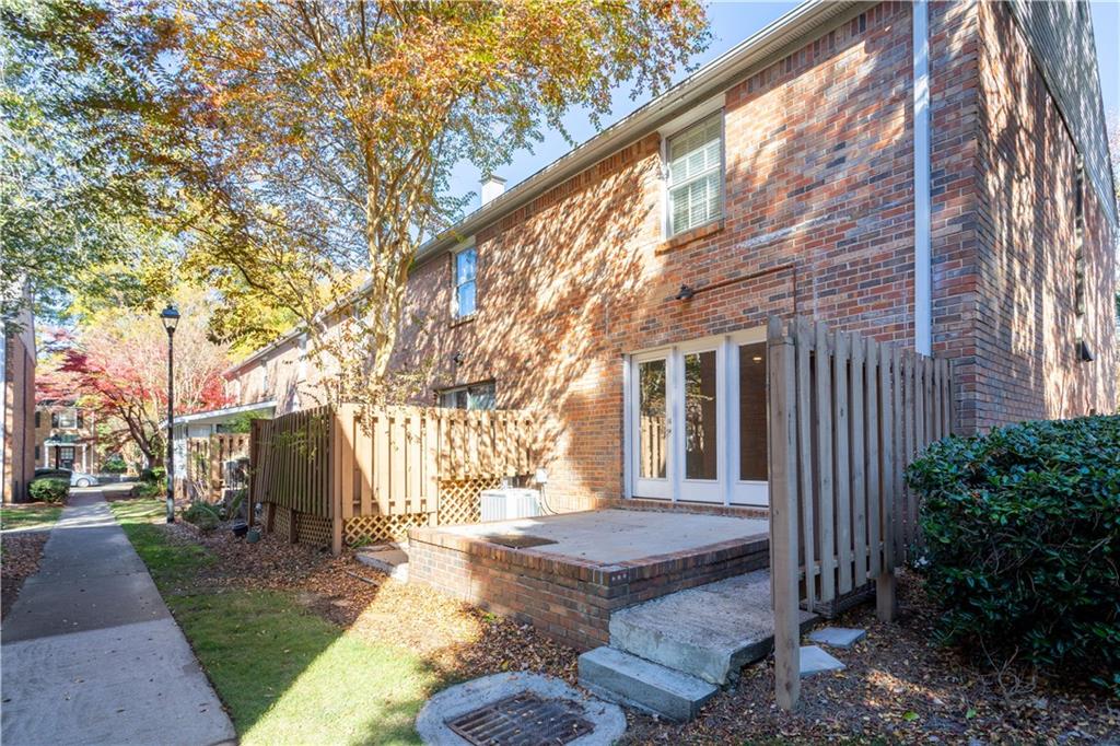 6700 Roswell Road, Unit 23A Atlanta, GA 30328 - Photo 15 of 18 a view of a house with backyard and trees