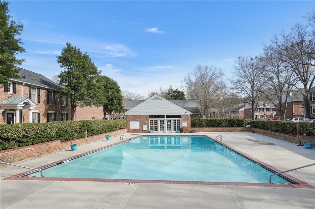 6700 Roswell Road, Unit 23A Atlanta, GA 30328 - Photo 16 of 18 a front view of a house with garden